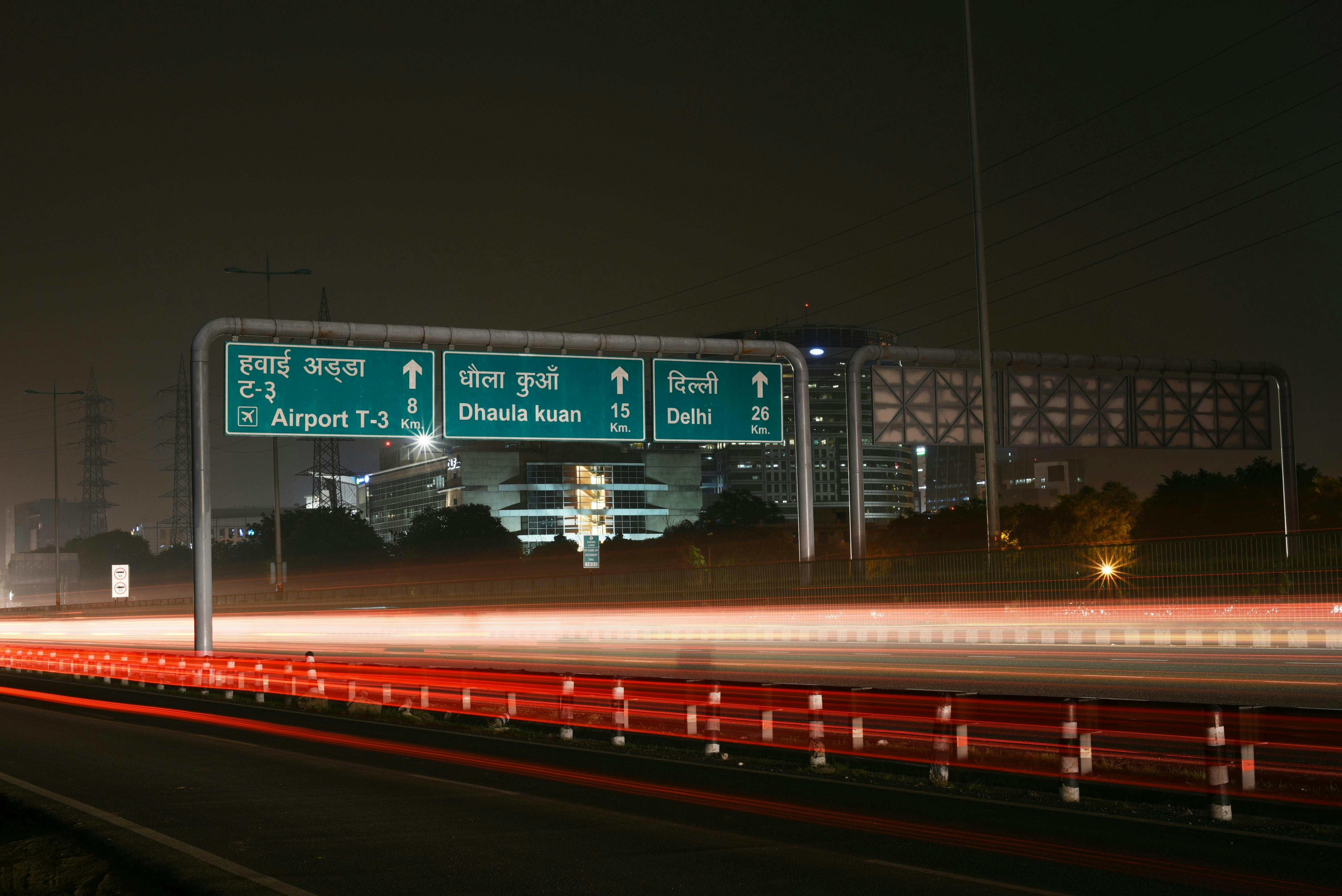 Road signs in Delhi, India, directing to an airport.