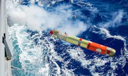 A Mk 46 recoverable exercise torpedo launches from a Mk 32 MOD 19 surface vessel torpedo tube through a torpedo firing door of the port torpedo magazine aboard the Ticonderoga-class guided-missile cruiser USS Shiloh (CG 67).