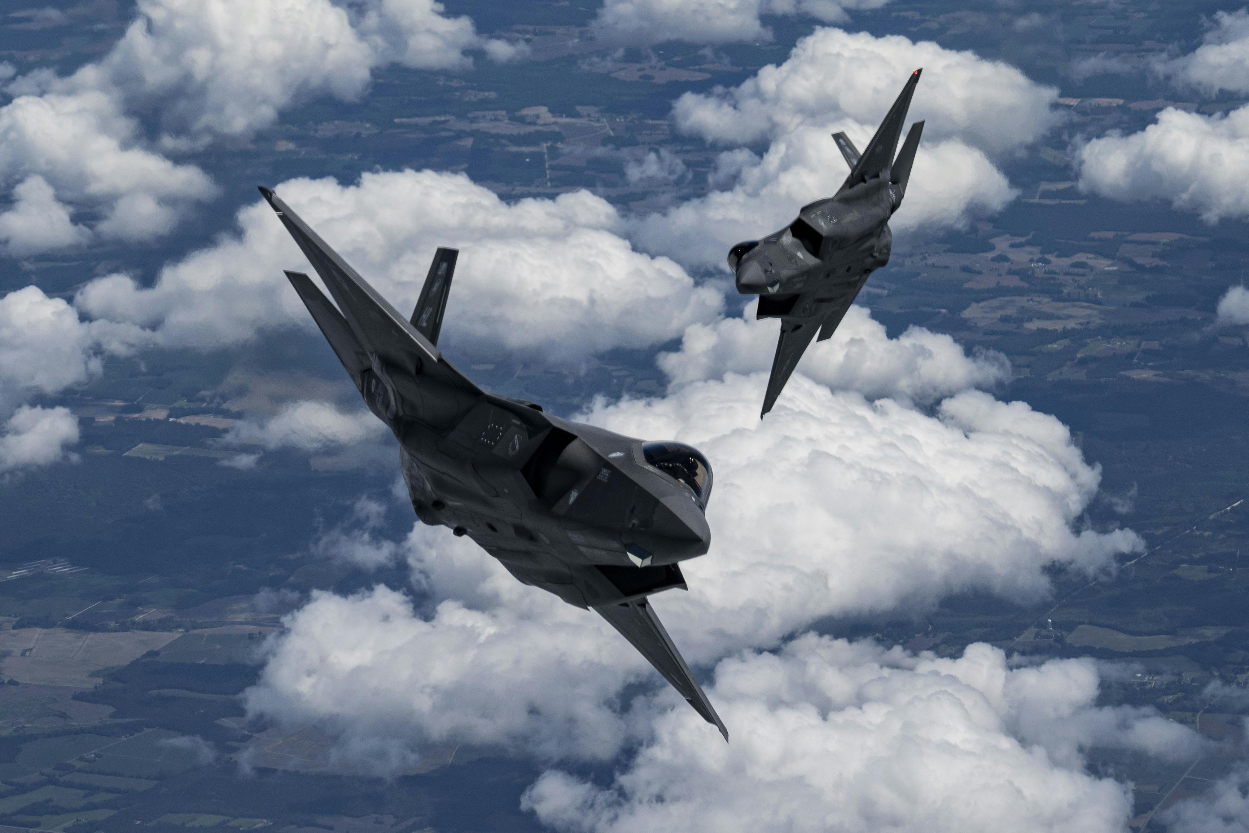 Two U.S. Air Force F-35A Lightning II aircraft fly in formation on the way to perform at the Air and Sea Air Show in Miami in May 2024.