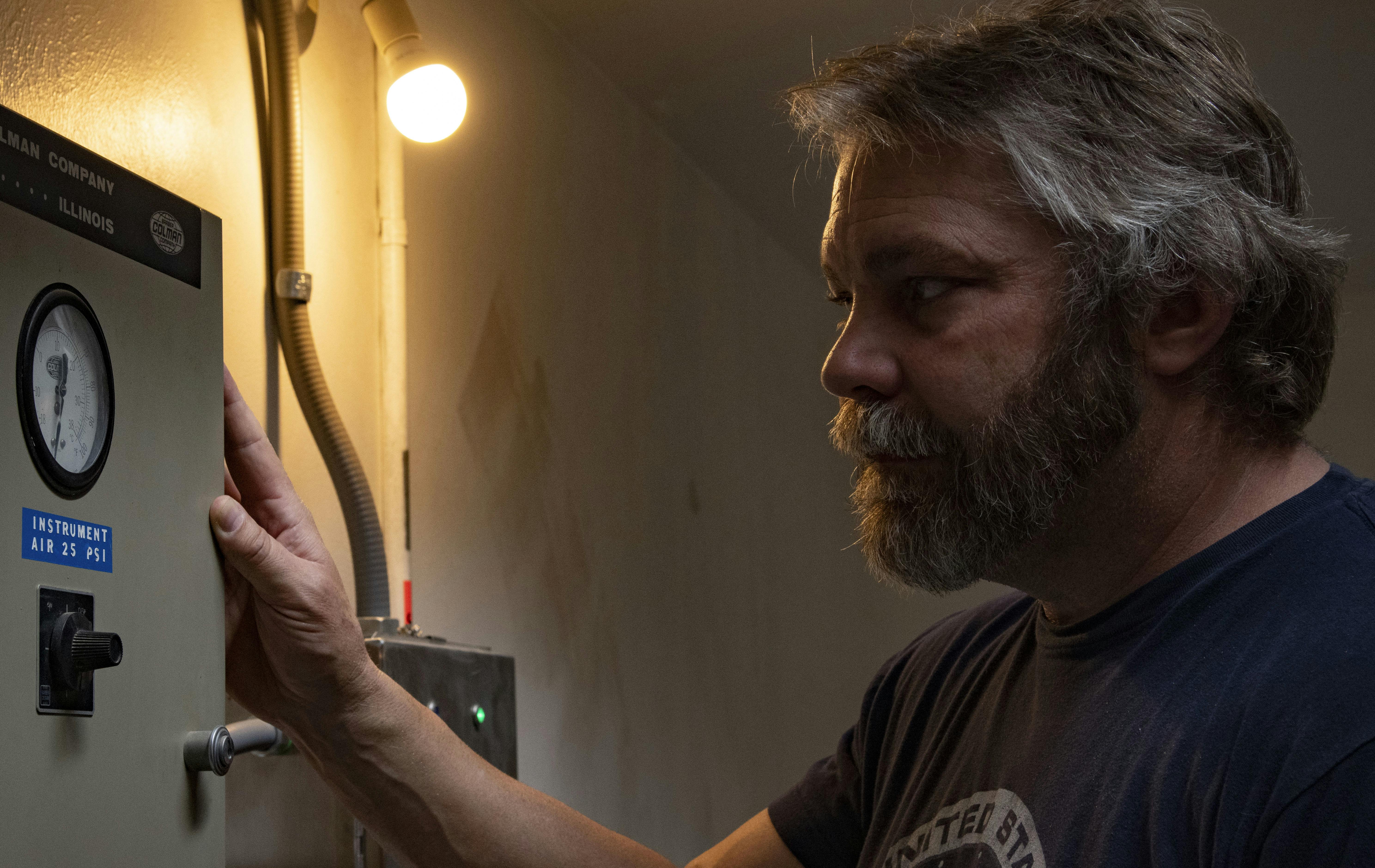 A cyber security expert at the Space Force 15th Space Surveillance Squadron, checks equipment for the Ground-Based, Electro-Optical Deep Space Surveillance Sensors at White Sands Missile Range, N.M., in 2022.