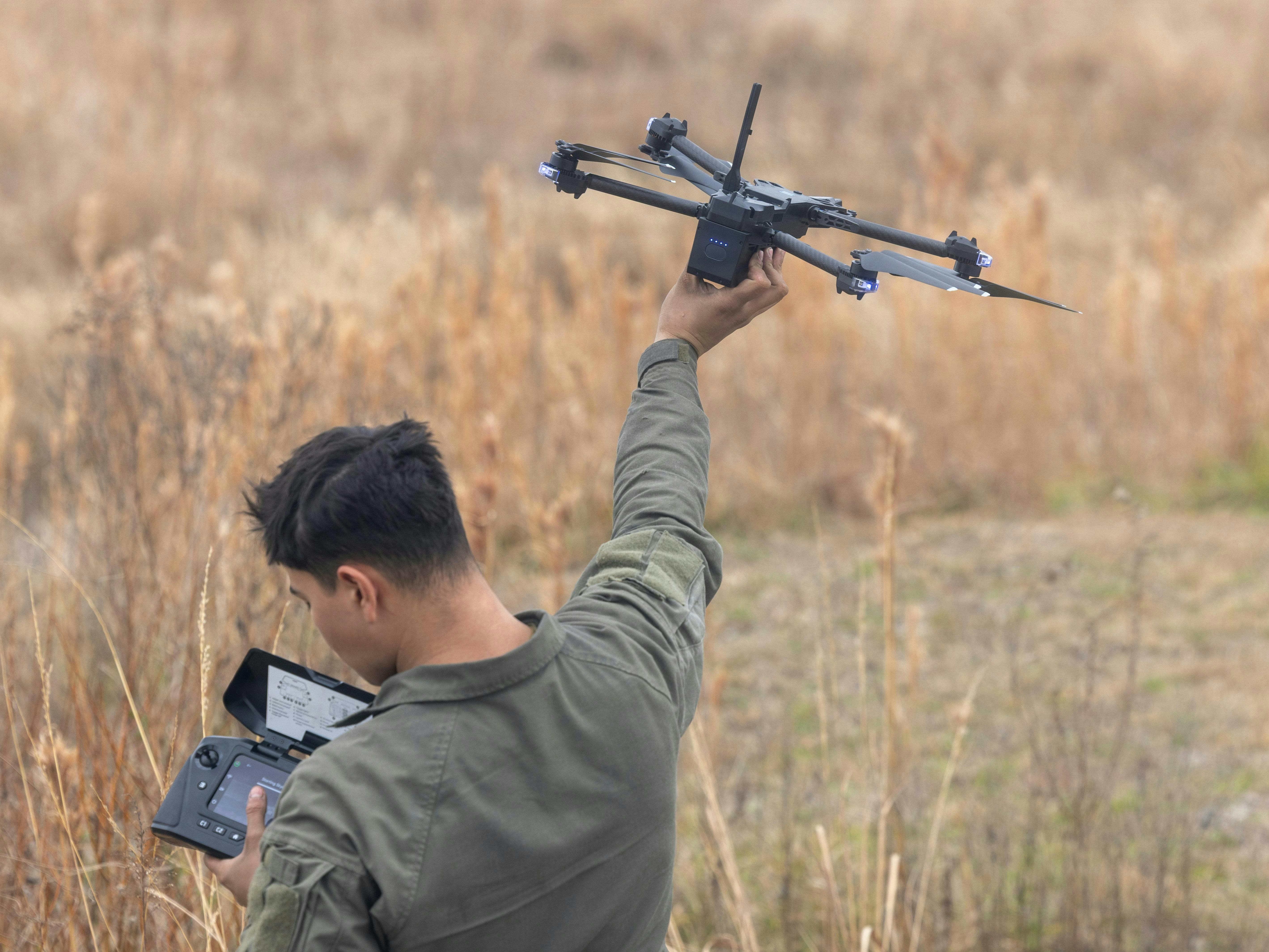 A U.S. Marine prepares a Skydio X2D small unmanned aircraft system during a gunnery qualification range on Marine Corps Base Camp Lejeune, N.C., last month.