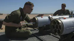 A Marine Corps aviation ordnance system technician loads a 2.75-inch rocket configured with Advanced Precision Kill Weapon System II at Marine Corps Air Station Yuma, Ariz., in 2018.