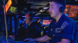 A surface sonar technicians operates a console inside of the combat information center of the Arleigh Burke-Class guided missile destroyer USS Benfold (DDG 65) last summer.