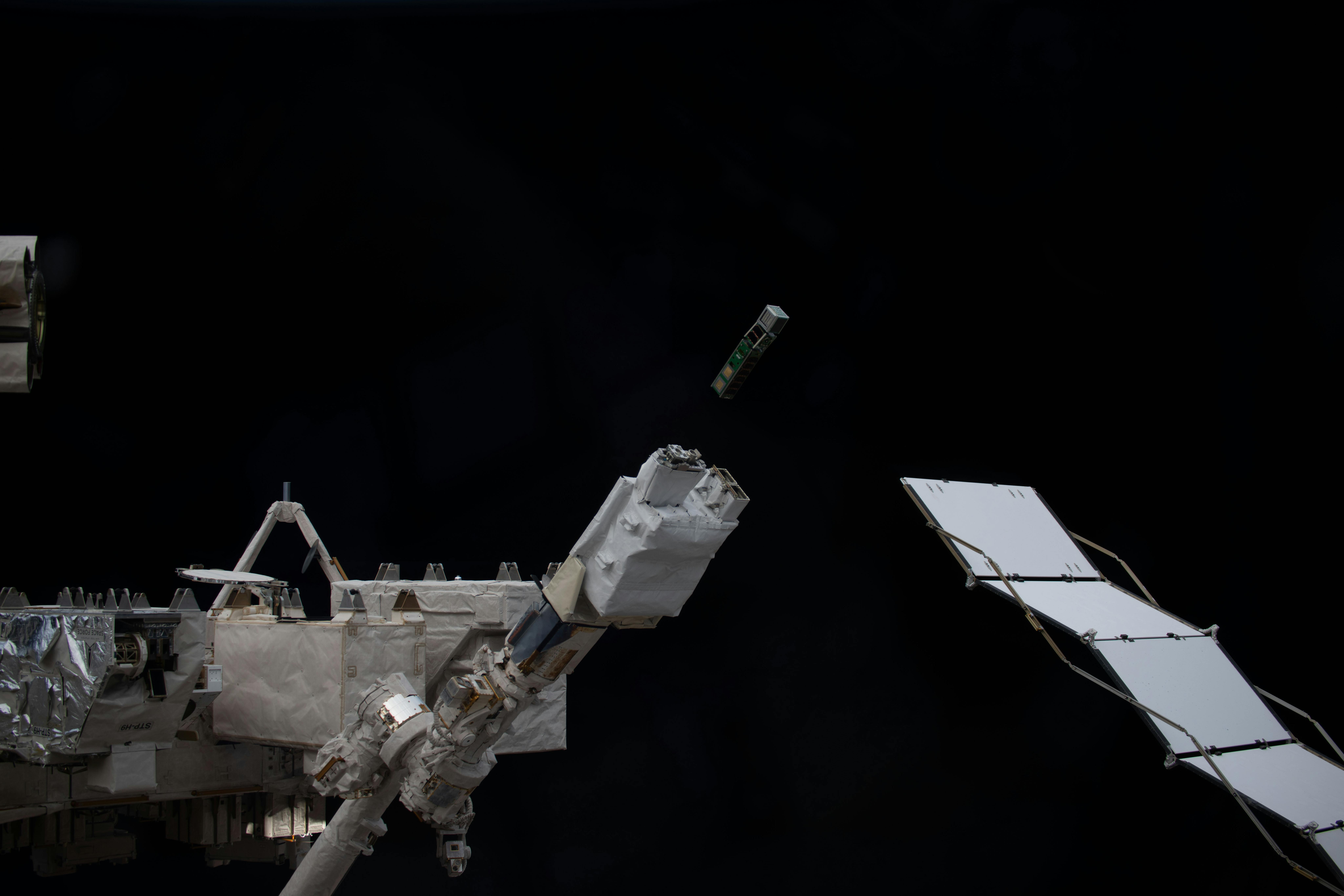 A trio of CubeSats designed by college students from around the world is deployed into Earth orbit from a small satellite orbital deployer on the outside of the International Space Station's Kibo laboratory module. Students from Mexico, Italy, Thailand, Malaysia, and Japan designed the shoe-box-sized satellites for a series of Earth observations and technology demonstrations. NASA image.