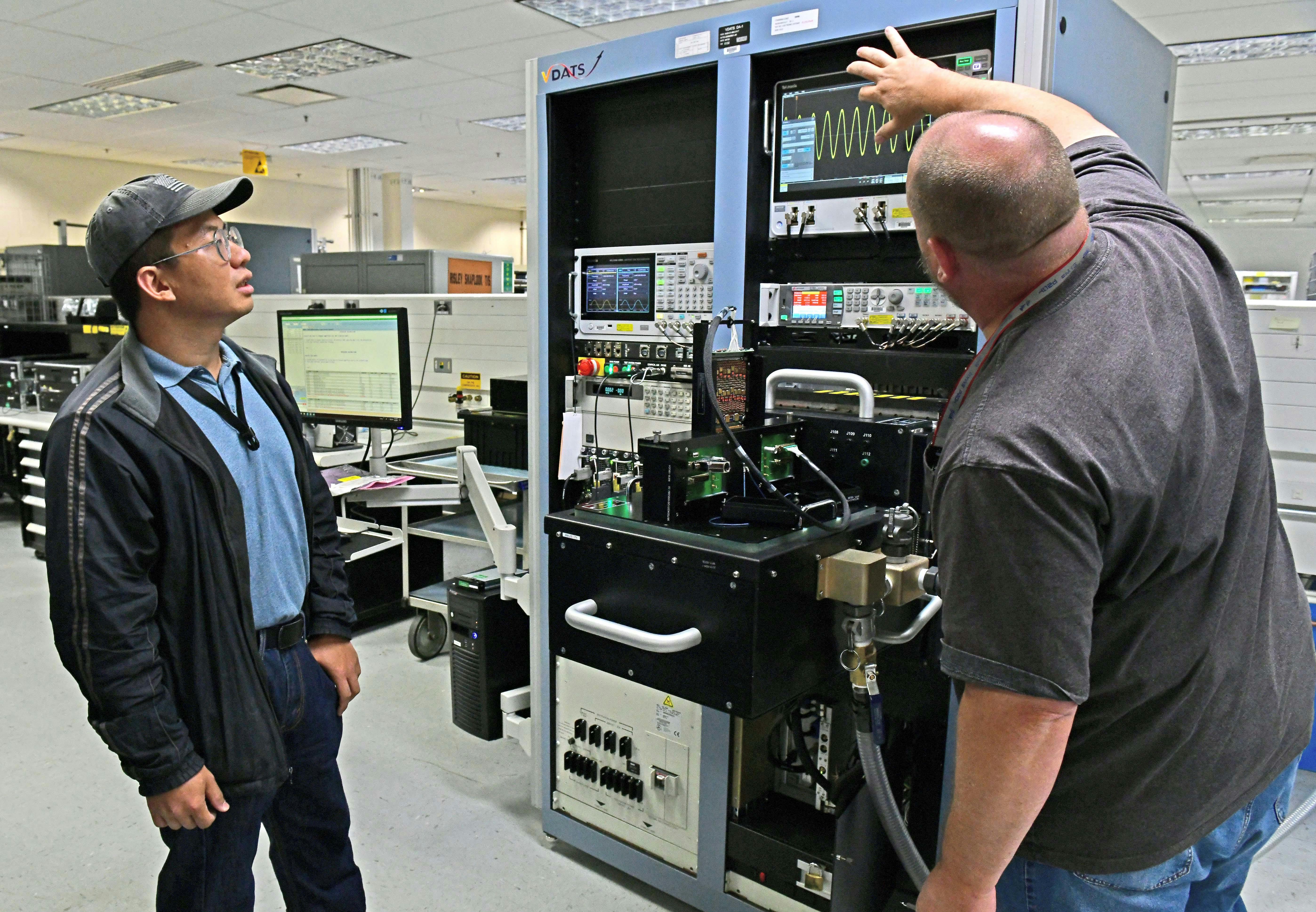 Engineers from the 402nd Software Engineering Group transfer data from an AM94 Legacy Test System to a Versatile Diagnostic Automated Test Station (VDATS) at Robins Air Force Base, Ga., in April 2024. The VDATS system replaced the 30-year old AM94 legacy test system.