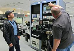 Engineers from the 402nd Software Engineering Group transfer data from an AM94 Legacy Test System to a Versatile Diagnostic Automated Test Station (VDATS) at Robins Air Force Base, Ga., in April 2024. The VDATS system replaced the 30-year old AM94 legacy test system.