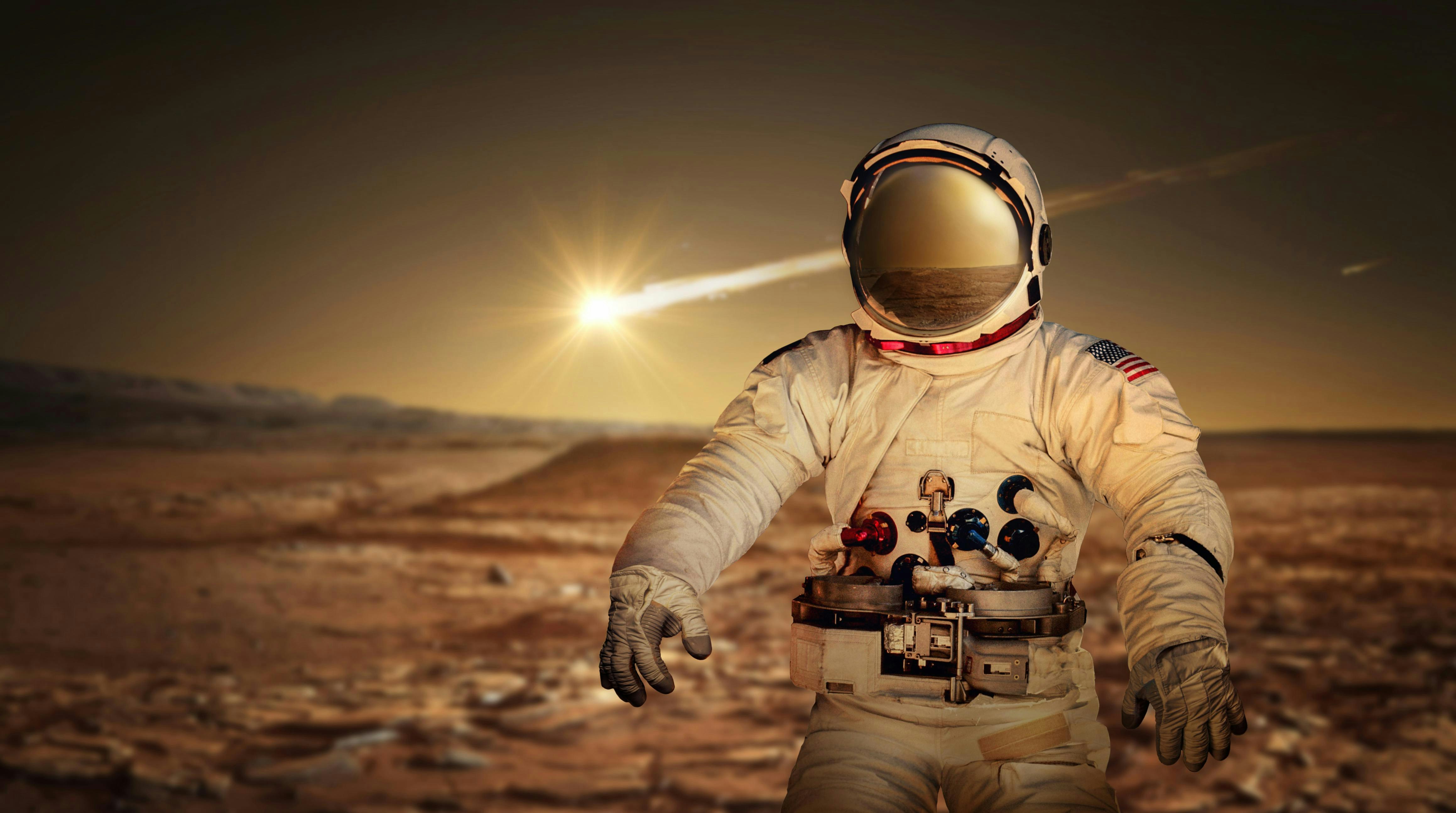 An astronaut exploring the surface of the red planet Mars. Space Mission. Elements of this image furnished by NASA. ID 114075666 &copy; Yevhenii Tryfonov | Dreamstime.com.