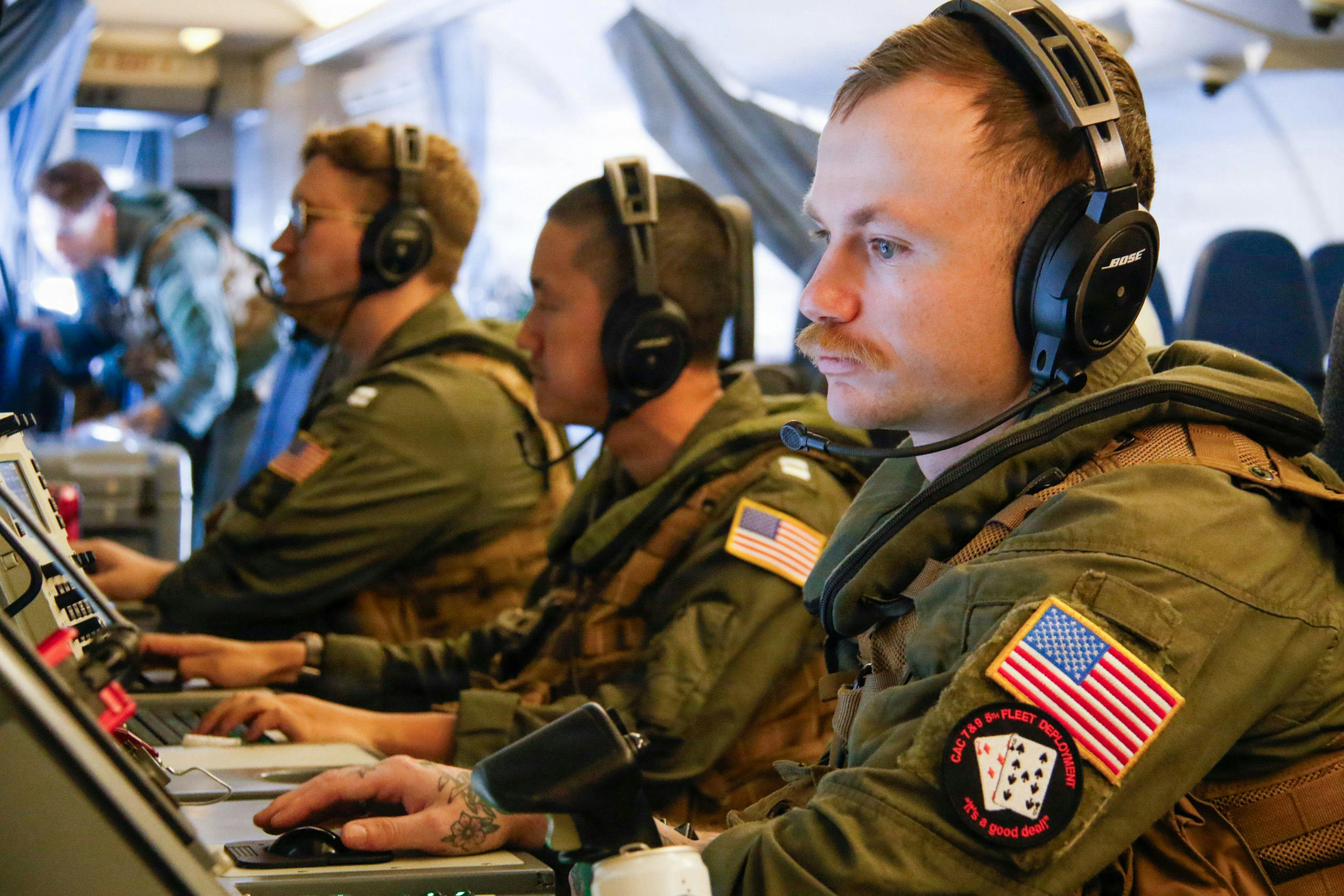 Navy P-8A crew members operate at mission control workstations during the Cutlass Express 2026 exercise last month.