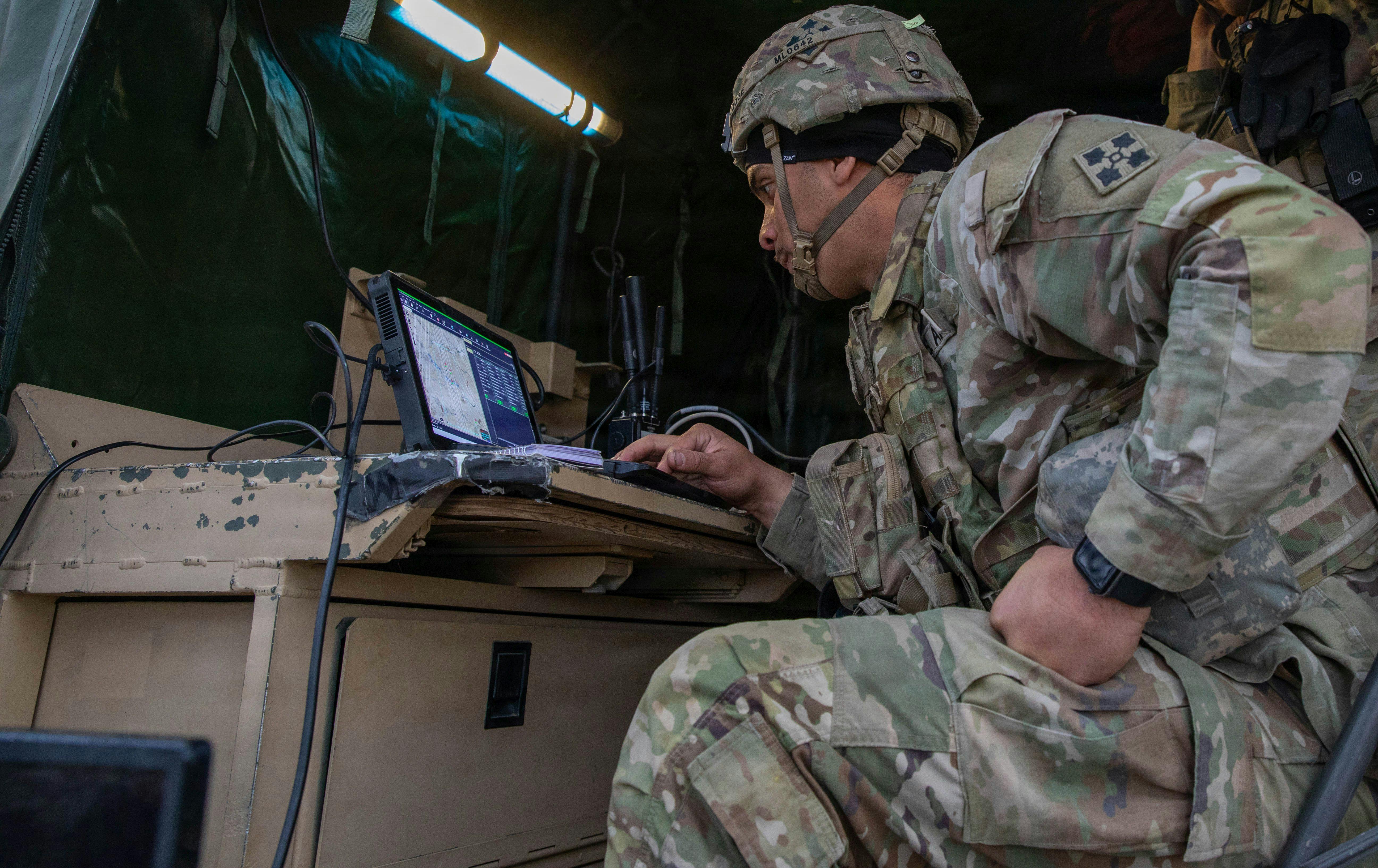 An Army fire control specialist monitors the Artillery Execution Suite (AXS) while supporting a live-fire exercise at Fort Carson, Colo., last month.