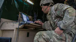 An Army fire control specialist monitors the Artillery Execution Suite (AXS) while supporting a live-fire exercise at Fort Carson, Colo., last month.