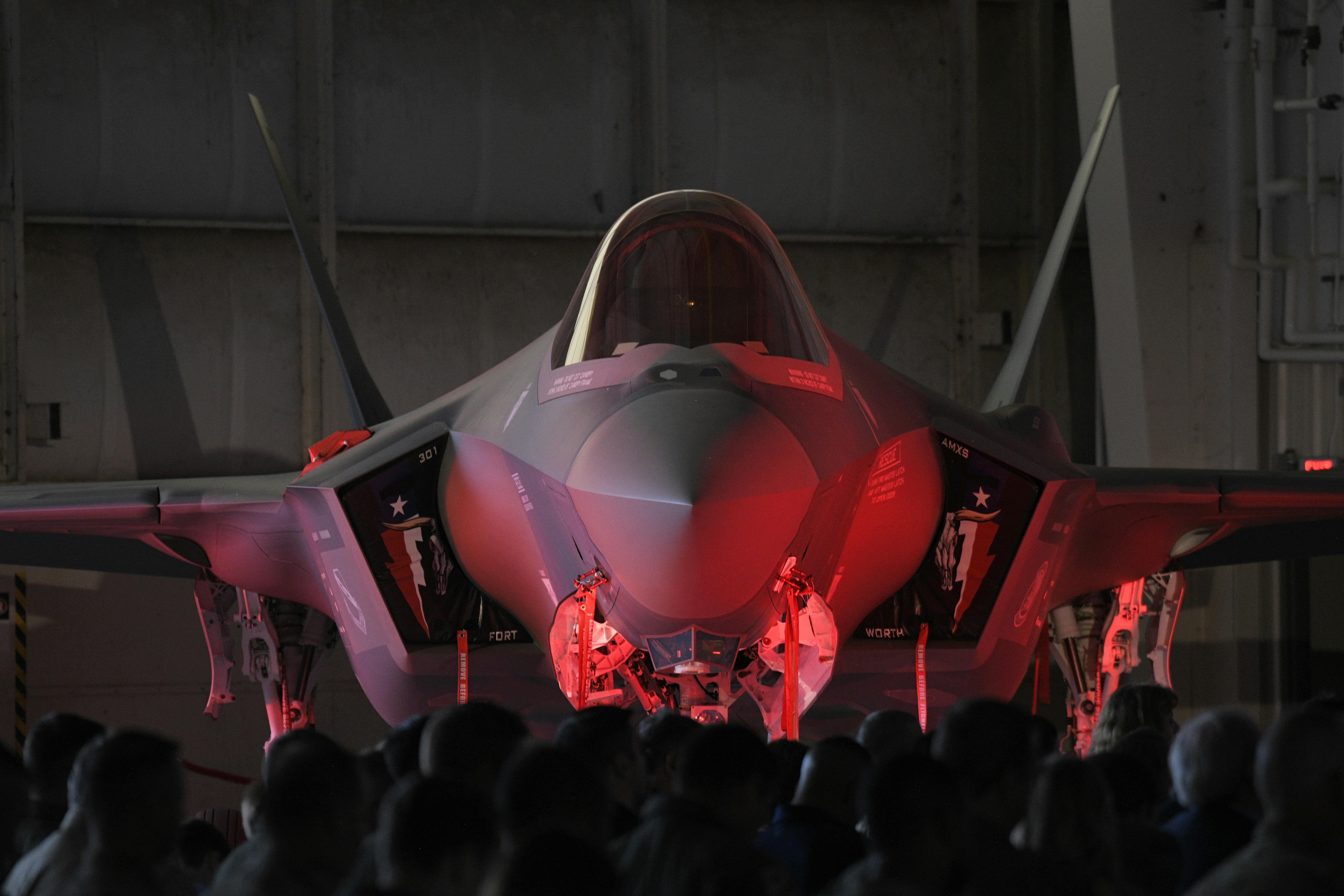 An F-35A Lightning II sits on display during an arrival ceremony at Naval Air Station Joint Reserve Base Fort Worth, Texas, in 2024. The advanced, connected fighter aircraft combines data from a variety of sensors, including advanced active electronically scanned array (AESA) radar, electro-optical distributed aperture systems, and integrated communication, navigation, and identification systems. U.S. Air Force photo by Staff Sgt. William Downs.