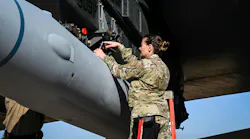 A U.S. Air Force loading standardization crew chief tightens bolts to secure the weapon to a B-52H bomber at Barksdale Air Force Base, La., in 2022 to validate the loading procedures for the Air Force's first hypersonic weapon. Air Force photo.