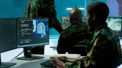 Programming engineer soldier handles AI brain and deep learning data on computer in command post, coordinates national defense operations.