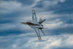 A Navy flight-demonstration team performs a precision aerial maneuver last September while flying F/A-18E/F Super Hornet jet fighter-bombers.