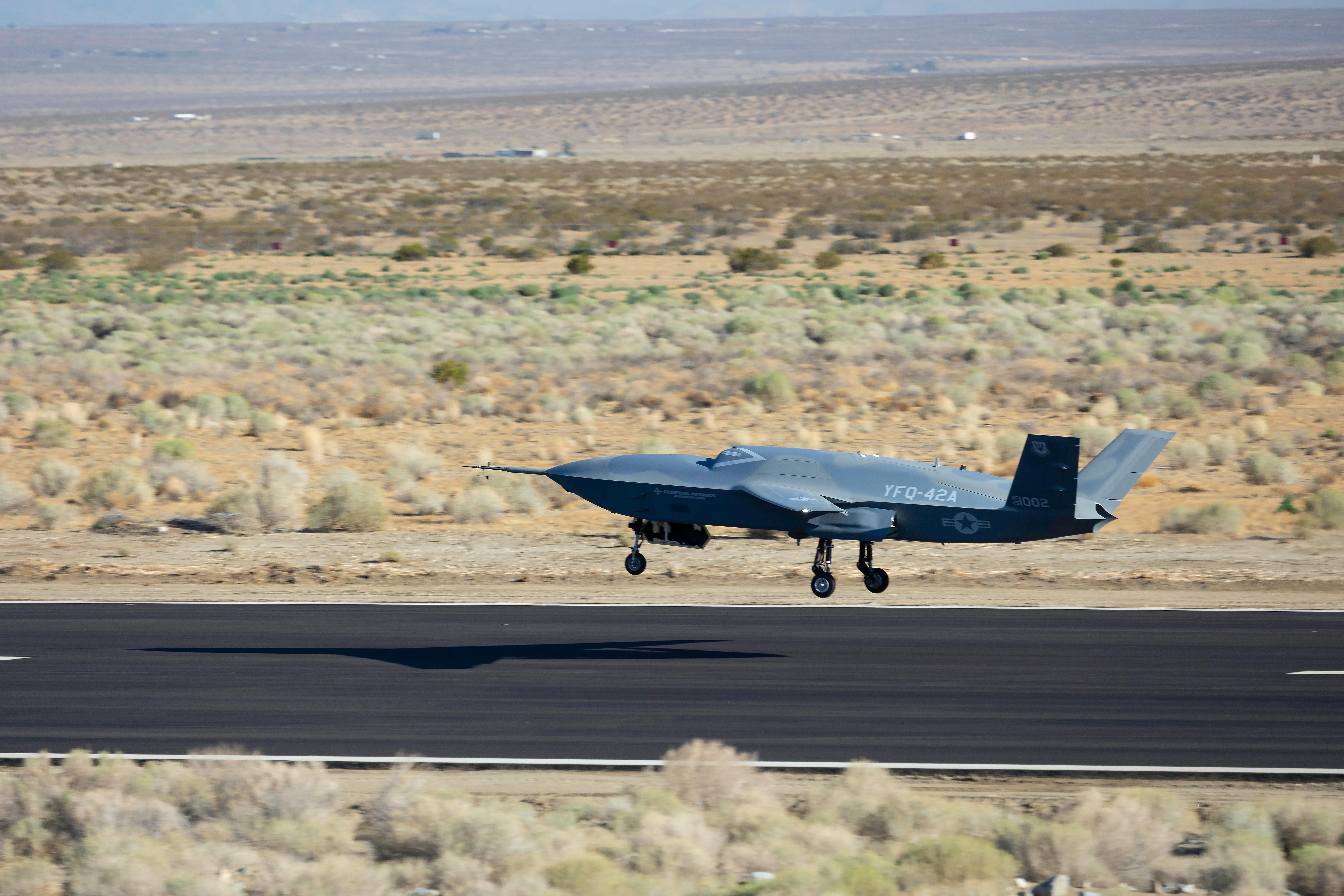 A YFQ-42A Collaborative Combat Aircraft lands after a test flight at a California test location. The program is structured to develop modular, uncrewed aircraft designed to operate alongside fifth and sixth-generation aircraft.