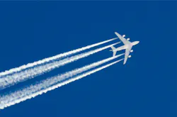 An aircraft and its contrails seen flying above in a blue sky An aircraft and its contrails seen flying above in a blue sky