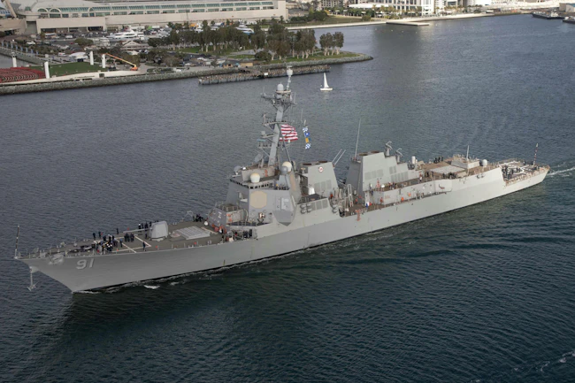 The USS Pinckney in harbor as seen from the sky.