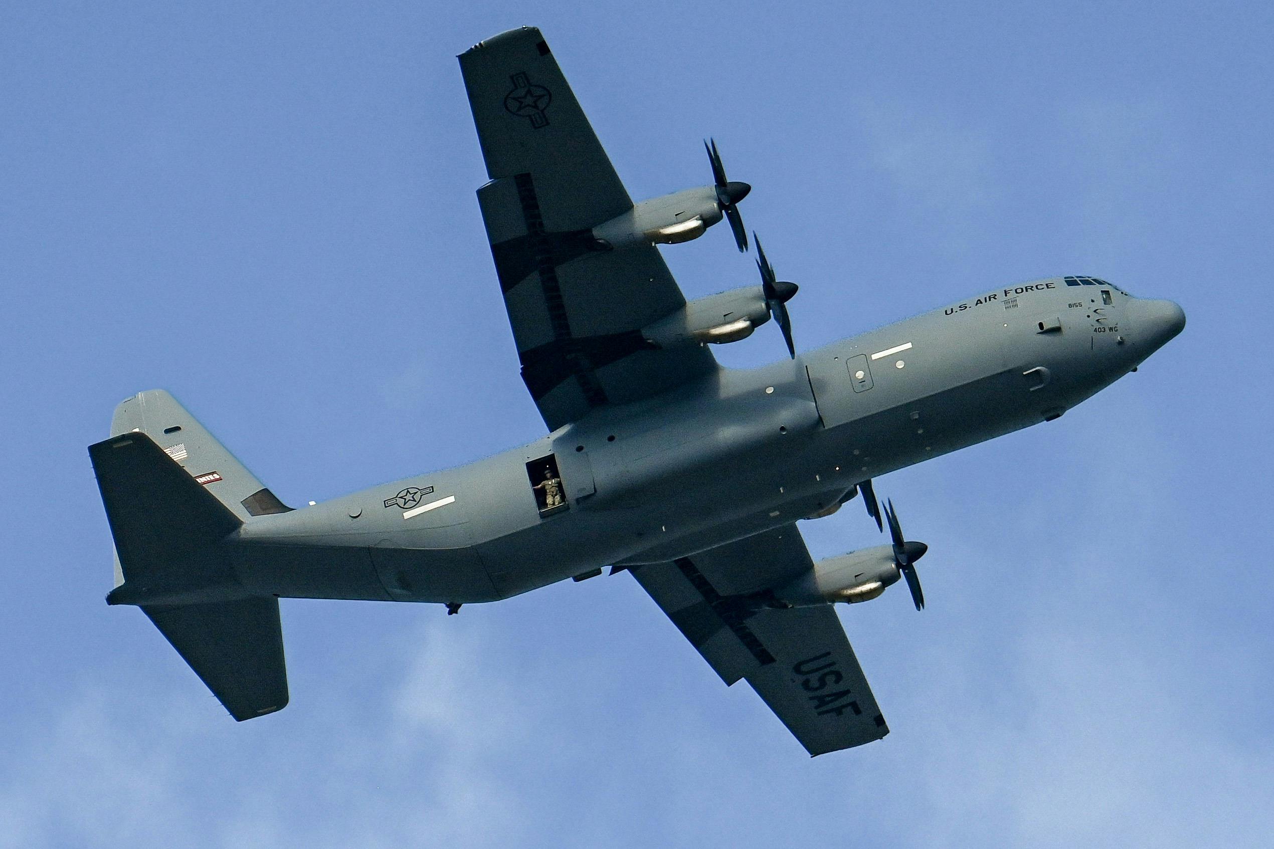 Airmen assigned to joint special operations forces fly a C-130J Super Hercules over MacDill Air Force Base, Fla. The joint operations exercise included service members assigned to the U.S. Special Operations Command, Special Operations Command Central, and Joint Communications Support Element. U.S. Air Force photo by Airman 1st Class Zachary Foster.