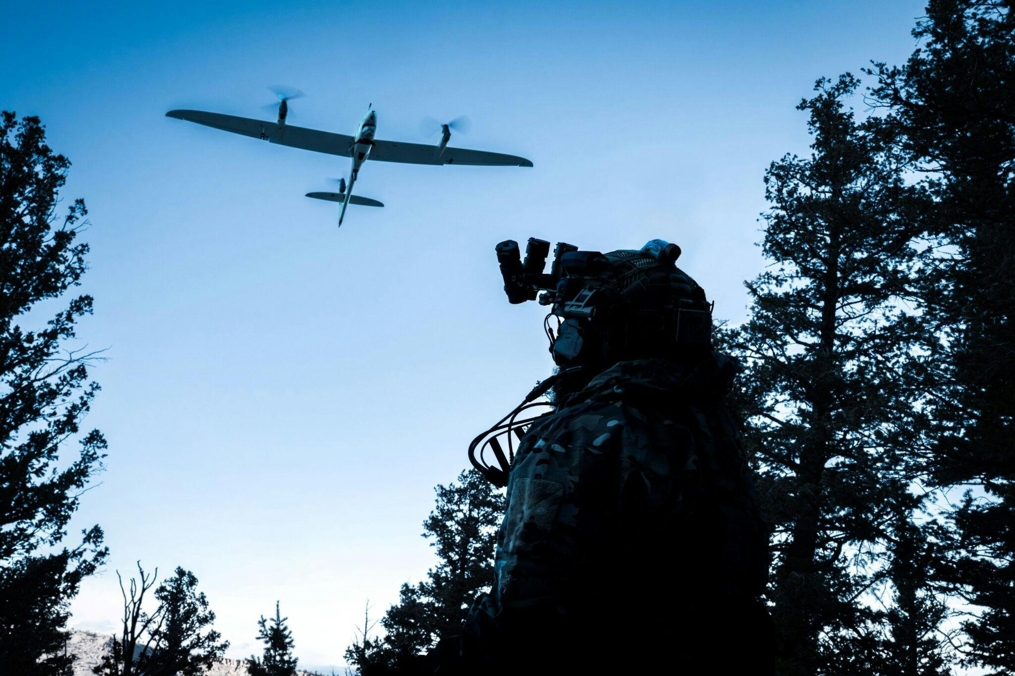 Quantum Systems Inc.'s eVTOL flies over a solider