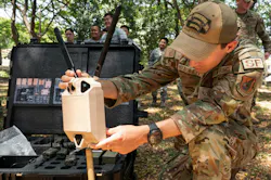 U.S. Air Force Senior Airman Christopher Bennett, 736th Security Forces instructor, works on an McQ sensor system during a Subject Matter Expert exchange at Basa Air Base, Philippines. U.S. Air Force photo by Staff Sgt. Jordan Garner. U.S. Air Force Senior Airman Christopher Bennett, 736th Security Forces instructor, works on an McQ sensor system during a Subject Matter Expert exchange at Basa Air Base, Philippines. U.S. Air Force photo by Staff Sgt. Jordan Garner.