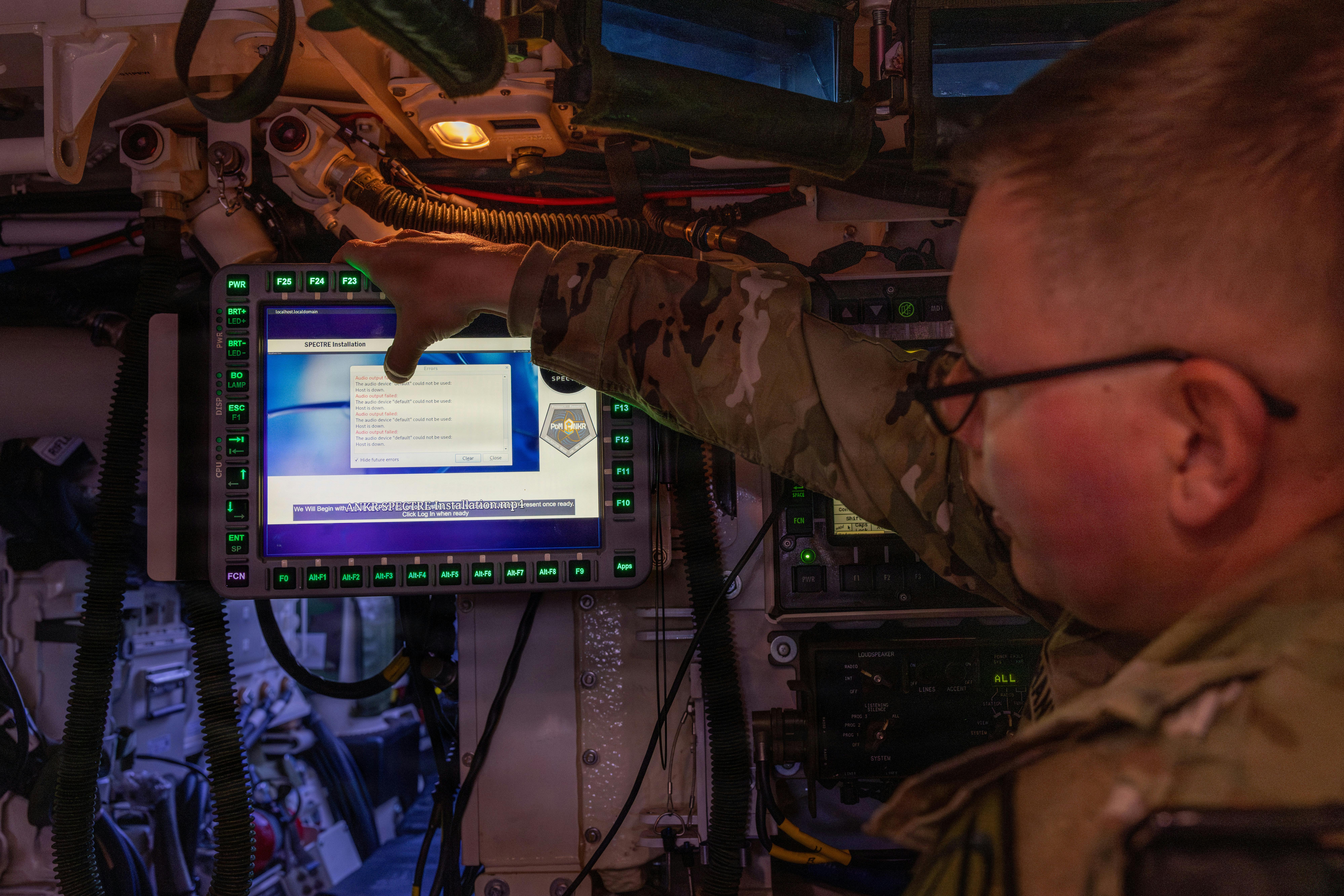 Lt. Col. David Hanna, Product Manager for Application Nexus for Key Resources (PdM ANKR) assigned to Capability Program Executive Command, Control, Communications, and Network (CPE C3N), demonstrates Spectre&rsquo;s embedded training system on a Stryker during exercise Ivy Sting 4 at Fort Carson, Colo. U.S. Army photo by Spc. Jonathan Reyes.