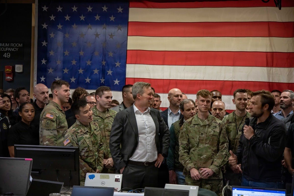 Dr. Alex Miller, Chief Technology Officer of the U.S. Army, provides opening comments during Operation Jailbreak on May 28, 2026, at Fort Carson, Colorado. Operation Jailbreak is the first in a series of combined Army and defense industry partnered hackathon events to integrate critical military technology systems as part of the overarching Right to Integrate effort. Army photo by SSgt. Richard Stewart, 4th Infantry Division Public Affairs Office.