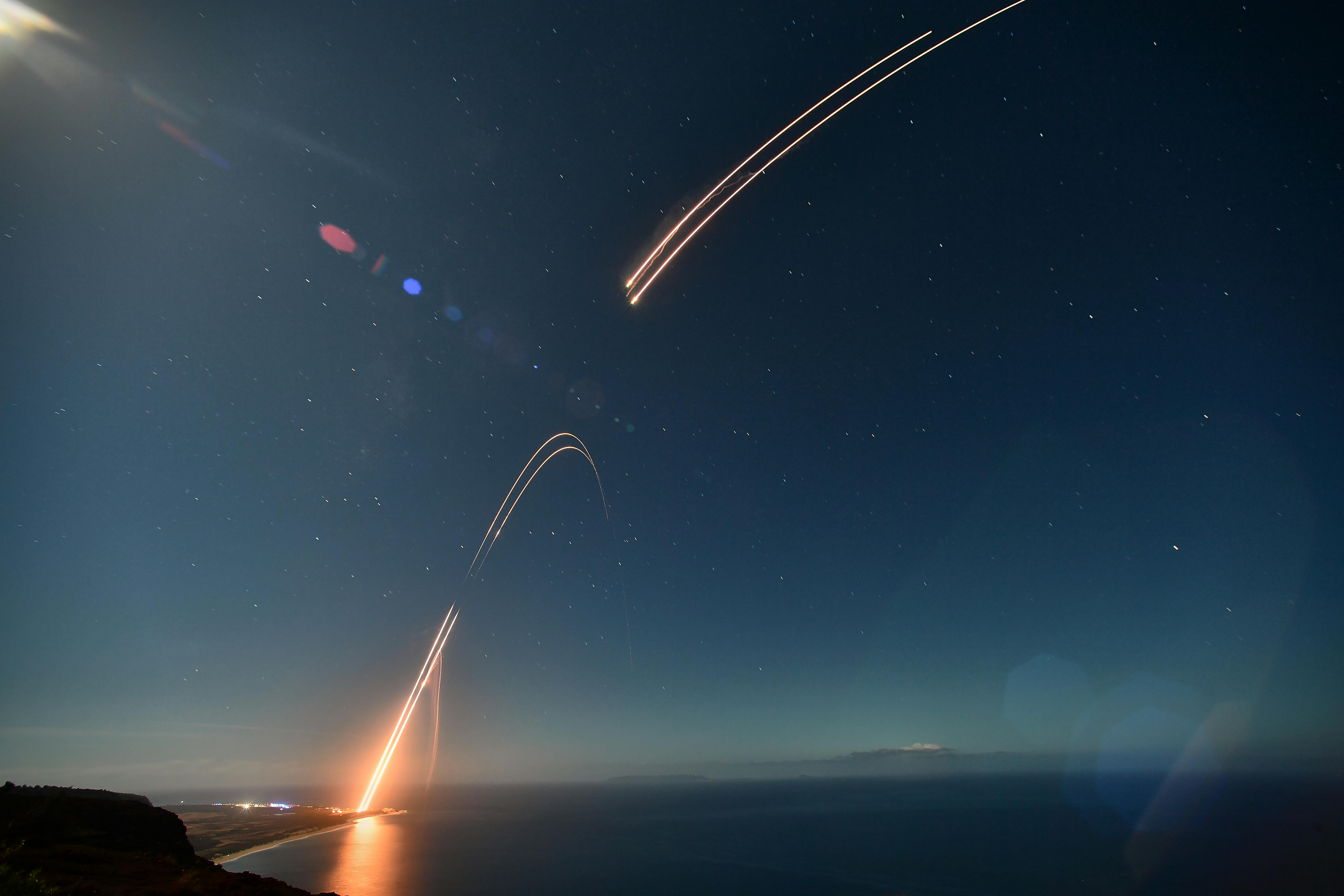 Two ballistic targets soar into the night sky at Pacific Missile Range Facility Barking Sands in Kauai. Naval Surface Warfare Center, Port Hueneme Division&rsquo;s White Sands Detachment personnel built and launched the targets for the Missile Defense Agency&rsquo;s Flight Mission Stellar Medusa, known as FTM-33. MDA Space was tapped by BAE for its hypersonic missile defense satellite system. U.S. Navy photo by the Pacific Missile Range Facility.