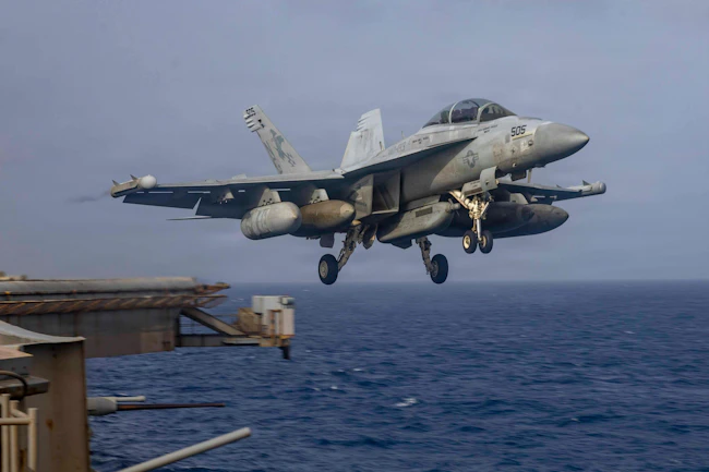 An EA-18G Growler, attached to Electronic Attack Squadron (VAQ) 133, takes off from the flight deck of Nimitz-class aircraft carrier USS Abraham Lincoln (CVN 72). Abraham Lincoln is deployed to the U.S. 5th Fleet area of operations to support maritime security and stability in the Middle East. U.S. Navy photo.