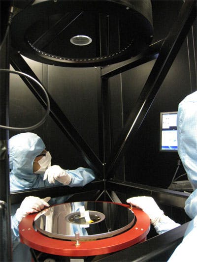 A 475mm diameter optical flat used as a reference surface to check the accuracy of the integration of the main mirrors in a satellite payload structure