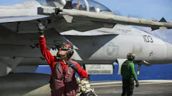 A Navy aviation ordnanceman arms up an AIM-9X missile on an F/A-18F Super Hornet on the flight deck of the Nimitz-class aircraft carrier USS Abraham Lincoln (CVN 72). U.S. Navy photo.