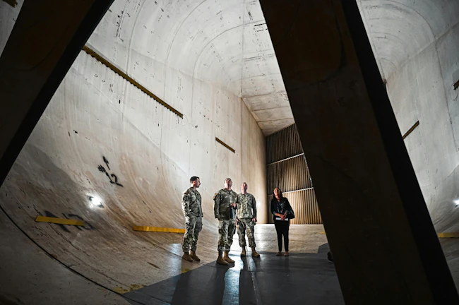 U.S. Airmen from Joint Base Langley-Eustis examine wind tunnel drive fans at NASA Langley Research Center, Va. Aerodynamicists use wind tunnels to test models of proposed aircraft. U.S. Air Force photo by Airman 1st Class Skylar Ellis.