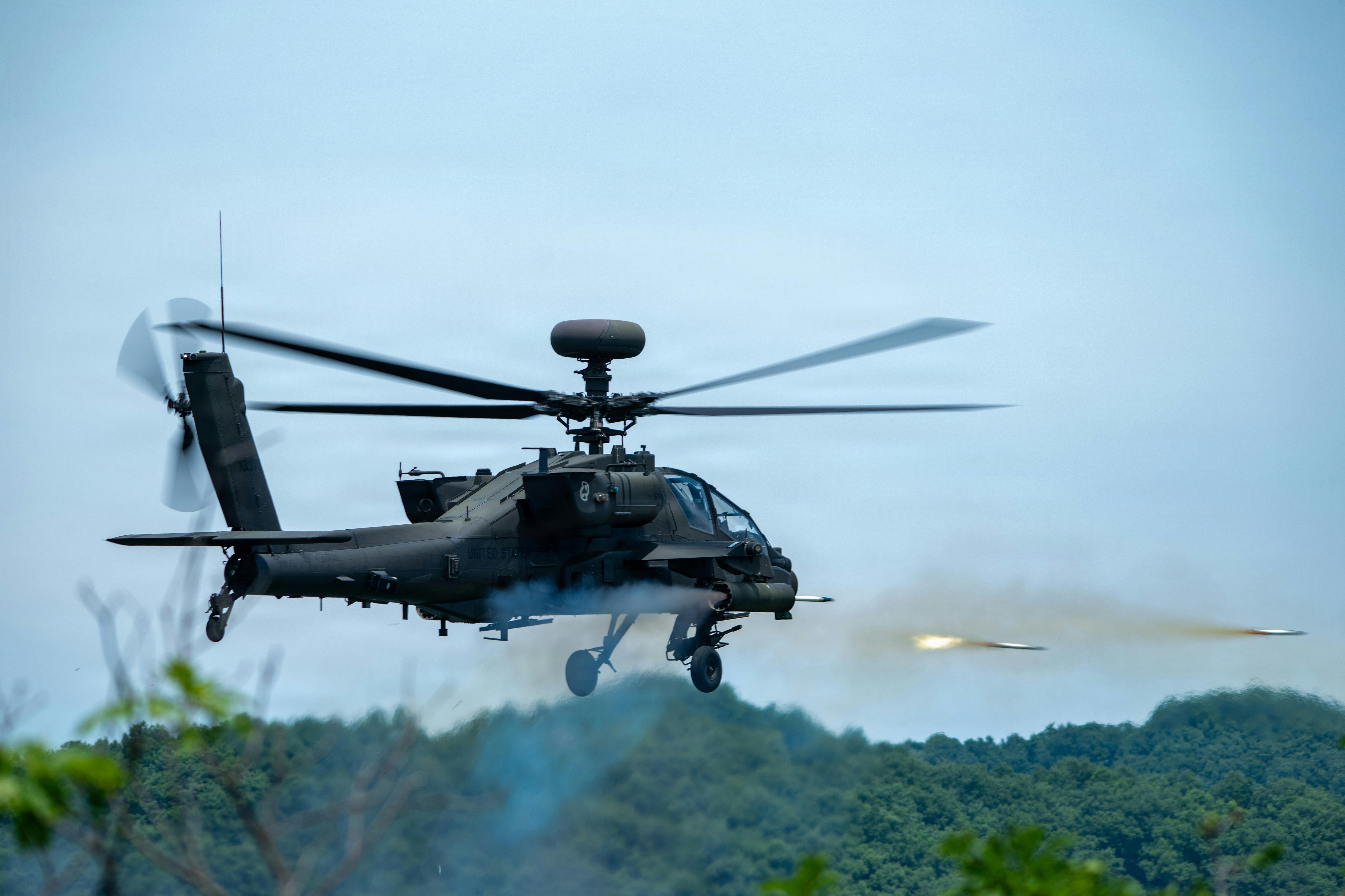 A U.S. Army AH-64 Apache assigned to 4th Battalion, 2nd Aviation Regiment, 2nd Combat Aviation Brigade, 2d Infantry Division/ROK-U.S. Combined Division fires during aerial gunnery at Rodriguez Live Fire Complex, South Korea. Aerial gunnery certifies AH-64 Apache aircrews on weapons employment and crew coordination during day and night conditions, ensuring mission-ready aviation forces across the Korean Peninsula. U.S. Army photo by Richard Kim.