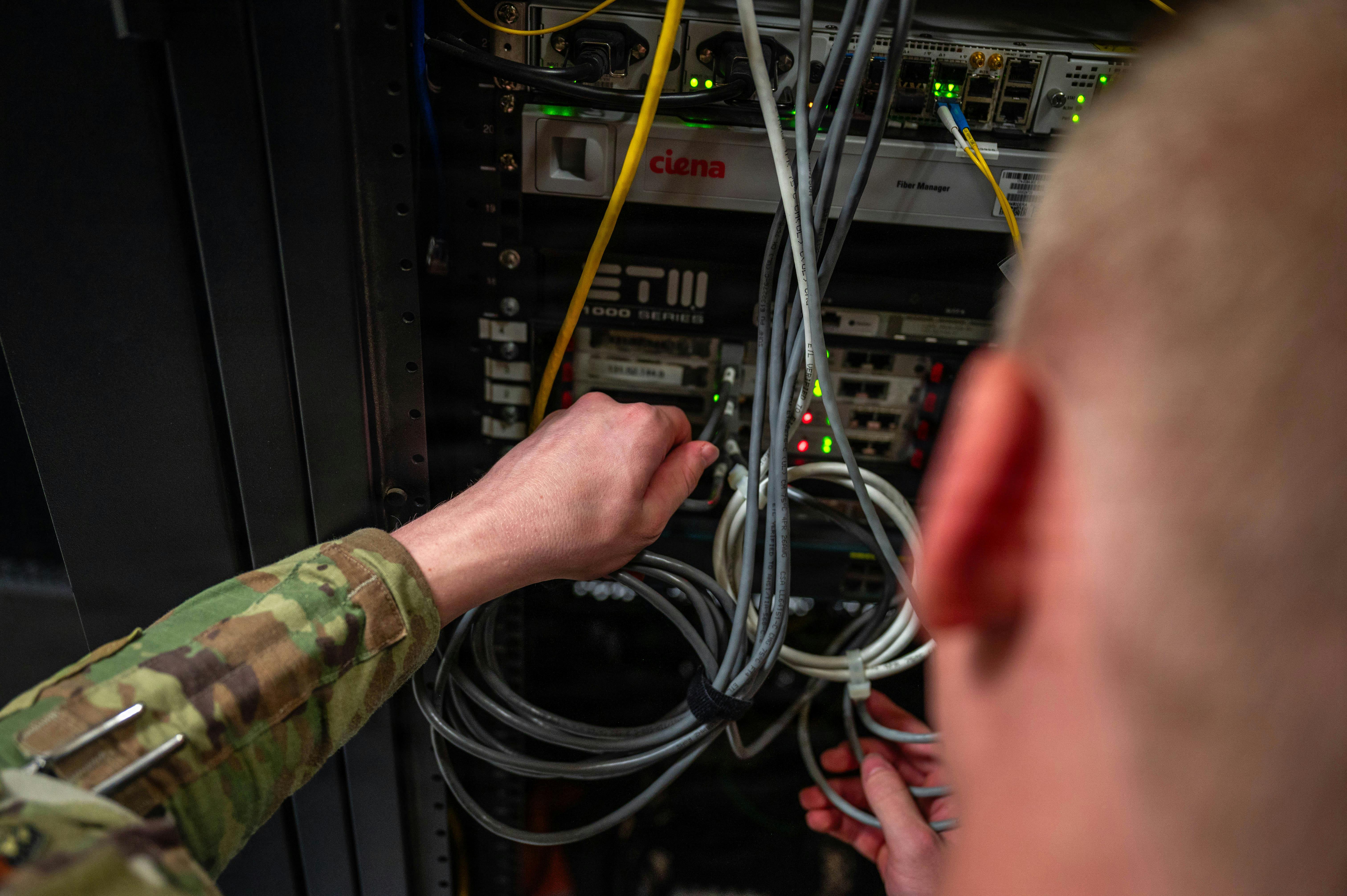 U.S. Air Force Airman 1st Class Dominic Puzzo, 56th Communications Squadron network systems operation technician, performs maintenance on a server at Luke Air Force Base, Arizona. U.S. Air Force photo by Airman 1st Class Tekorey Watkins.