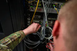 U.S. Air Force Airman 1st Class Dominic Puzzo, 56th Communications Squadron network systems operation technician, performs maintenance on a server at Luke Air Force Base, Arizona. U.S. Air Force photo by Airman 1st Class Tekorey Watkins.