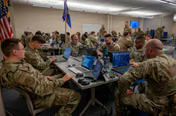 Service members from the 175th Cyberspace Operations Group at Martin State Airport and Fort Meade and the Maryland Army National Guard Cyber Protection Team 169 work in teams to compete in the 175th Cyberspace Operations Group Capture the Flag event at Martin State Air National Guard Base, Md. U.S. Air National Guard photo by Staff Sgt. Laura Virtue.