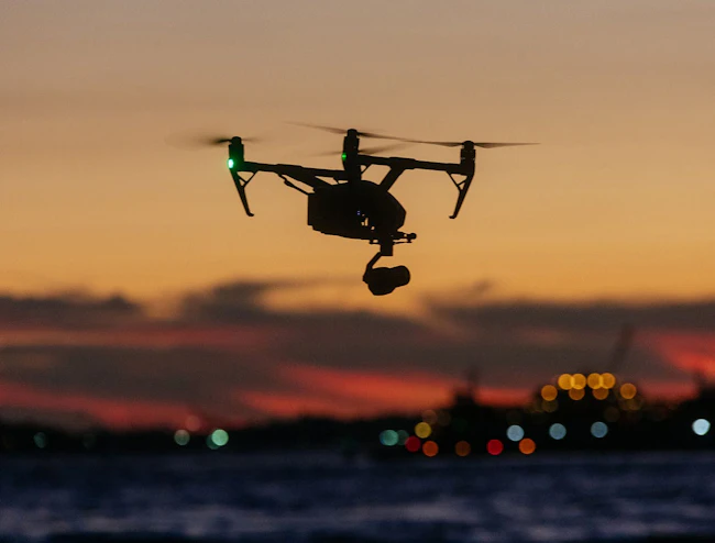 6a639bce9d056596806779f1 Honaerodronesunsetoverwater1664x1264px