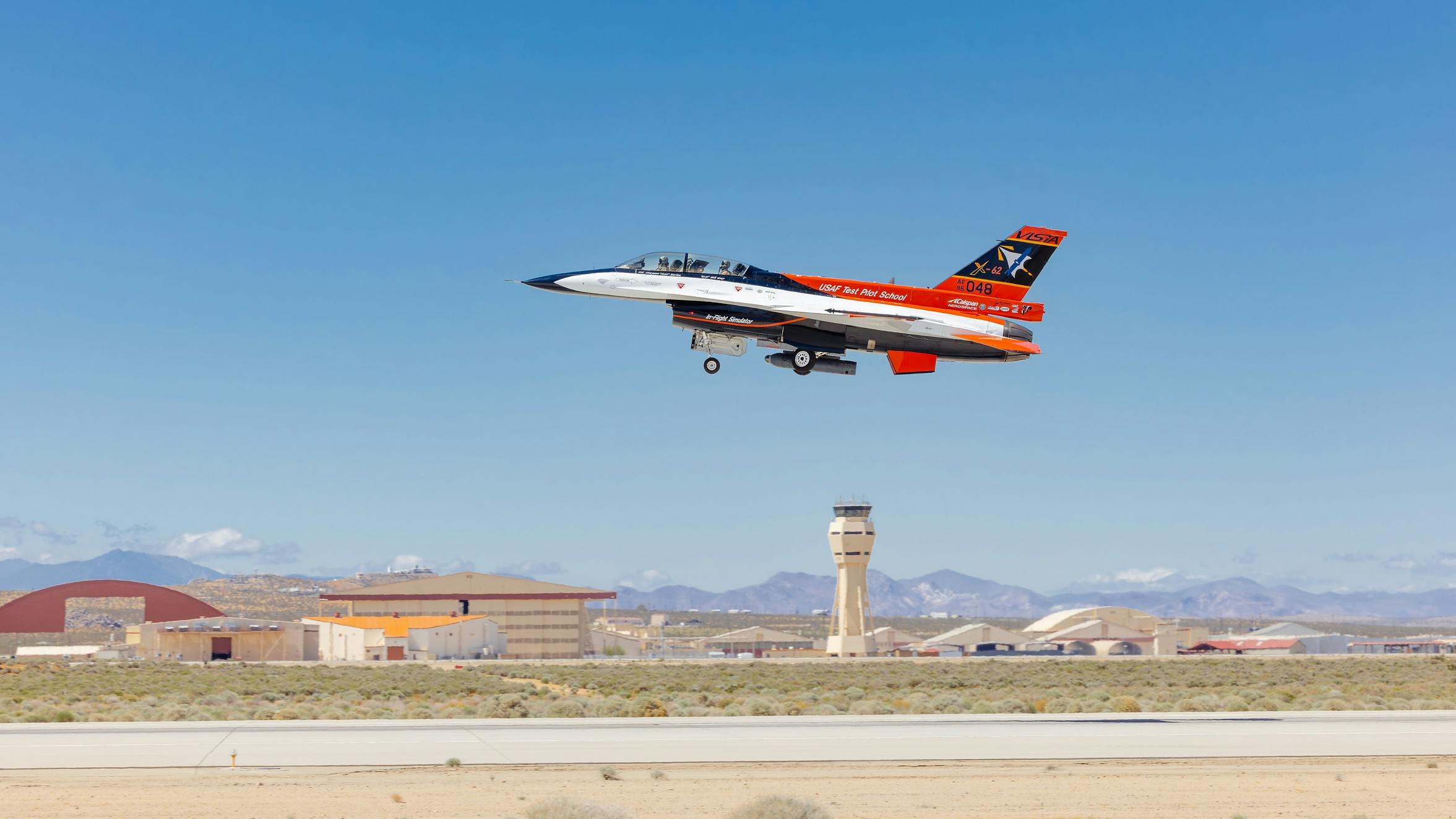 The X-62A VISTA takes off for an AI flight test at Edwards Air Force Base, Calif., with the Legion Pod installed. U.S. Air Force photo.