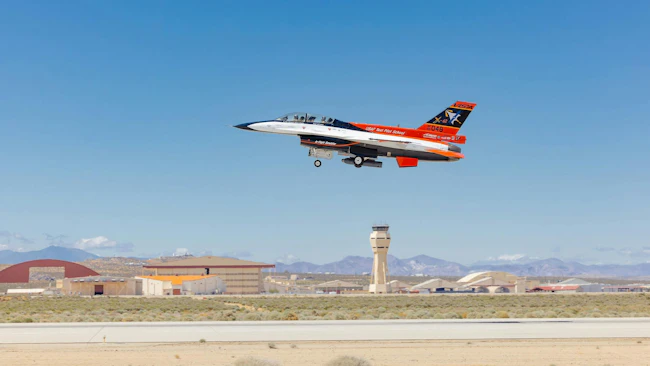 The X-62A VISTA takes off for an AI flight test at Edwards Air Force Base, Calif., with the Legion Pod installed. U.S. Air Force photo.