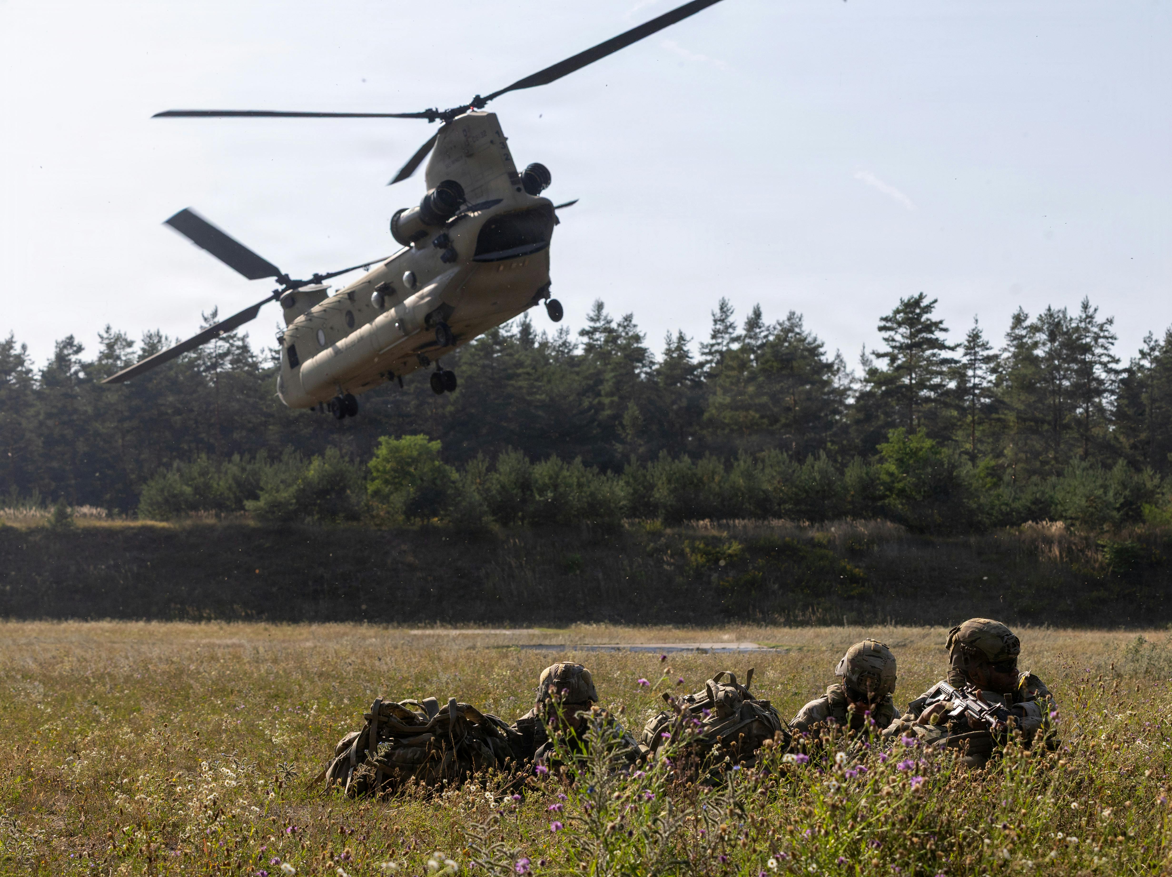 U.S. Army Soldiers pull security after exiting a CH-47 Chinook helicopter during the U.S. Army Europe and Africa Best Squad Competition at Grafenwoehr Training Area, Germany. U.S. Army photo by Sgt. Griffin Payne.