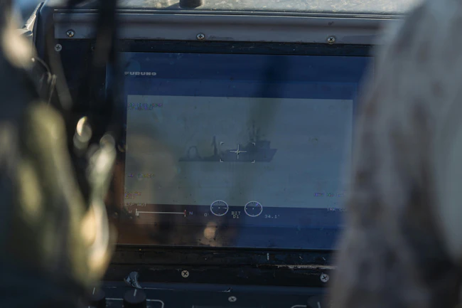 U.S. Marines with Maritime Reconnaissance Platoon, 1st Reconnaissance Battalion, 1st Marine Division, observe a vessel while conducting maritime domain awareness during Exercise Steel Knight 25 at San Clemente Island, Calif. USMC photo by Lance Cpl. Alan Gomez.