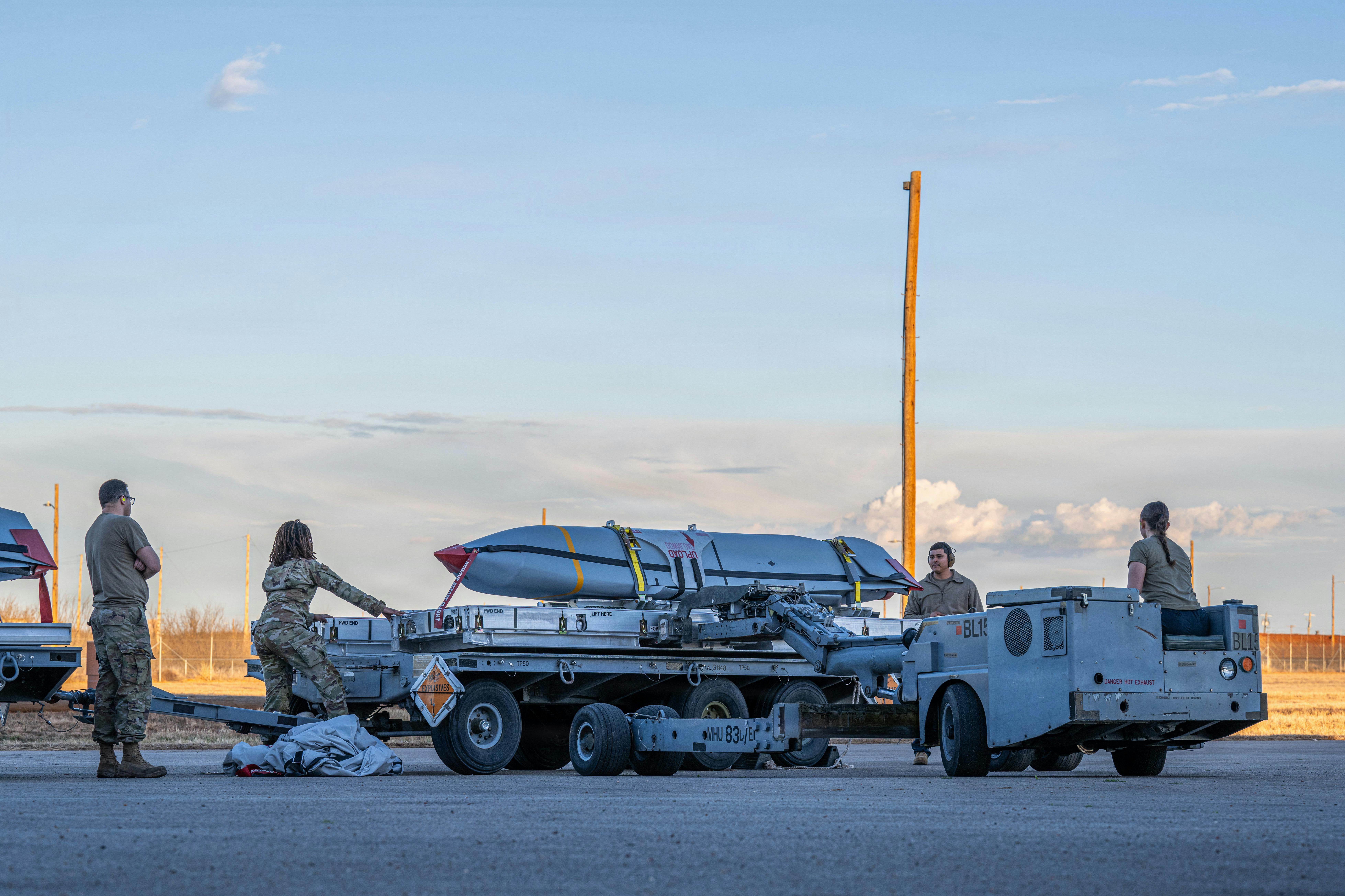 U.S. Airmen assigned to the 7th Munitions Squadron use an MHU-830 Lift Truck to transport a Joint Air-to-Surface Standoff Missile at Dyess Air Force Base, Texas. U.S. Air Force photo by Airman 1st Class Caleb Schellenberg.