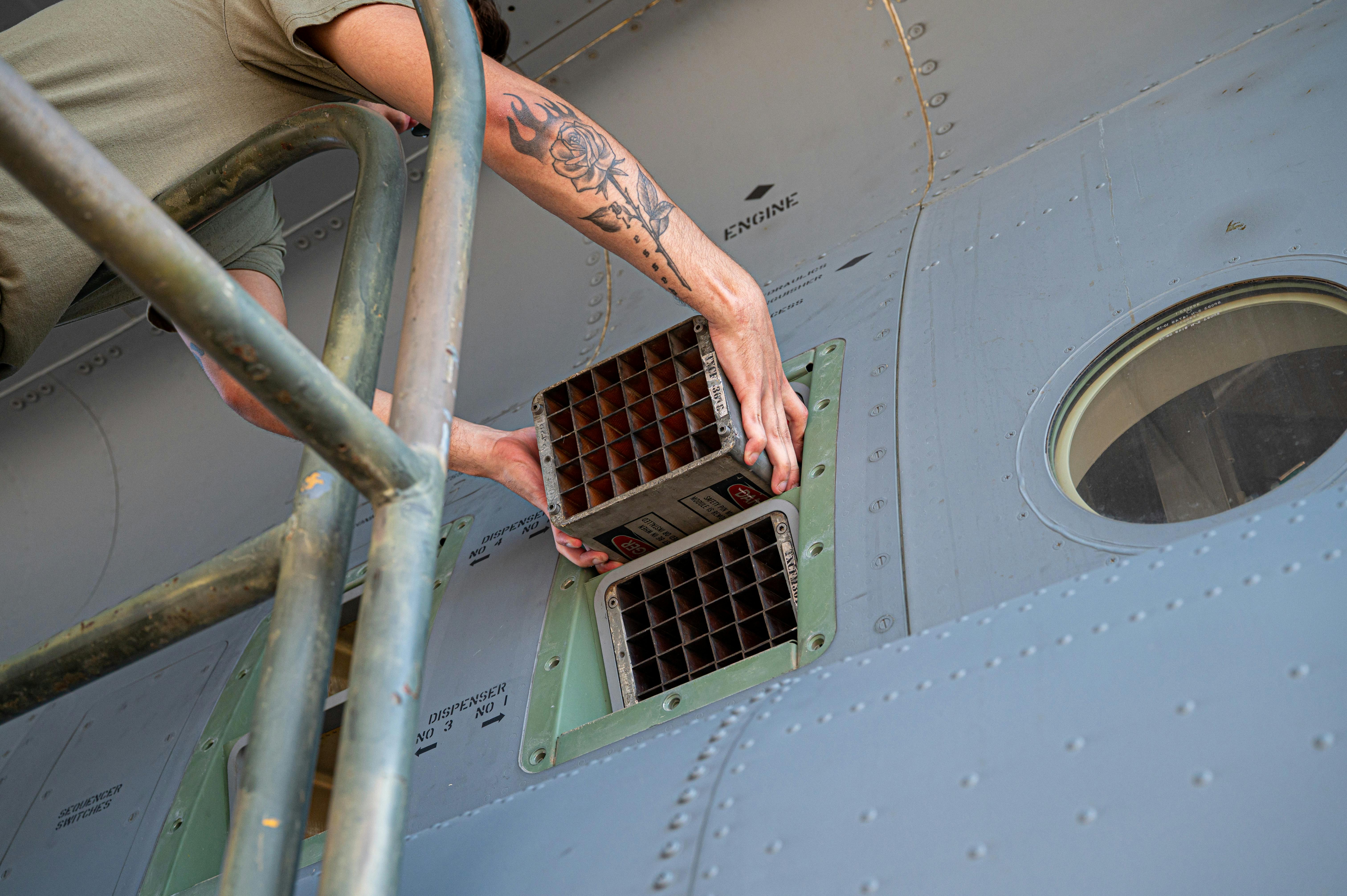 U.S. Air Force Tech. Sgt. Alexis Areizaga-Irizarry, an avionics technician with the 165th Maintenance Squadron, Georgia Air National Guard, practices loading countermeasures on a C-130J Hercules aircraft while attending the Weapon Task Qualification Manager/Munitions Training Course at Naval Air Station Joint Reserve Base Fort Worth, Texas, August 7, 2024. The WTQM course, taught by the Advanced Airlift Tactics Training Center, based in St. Joseph, Missouri, includes training in the uploading of expendables in the ALE-47 Chaff and Flare Systems. U.S. Air National Guard photo by Master Sgt. Patrick Evenson.
