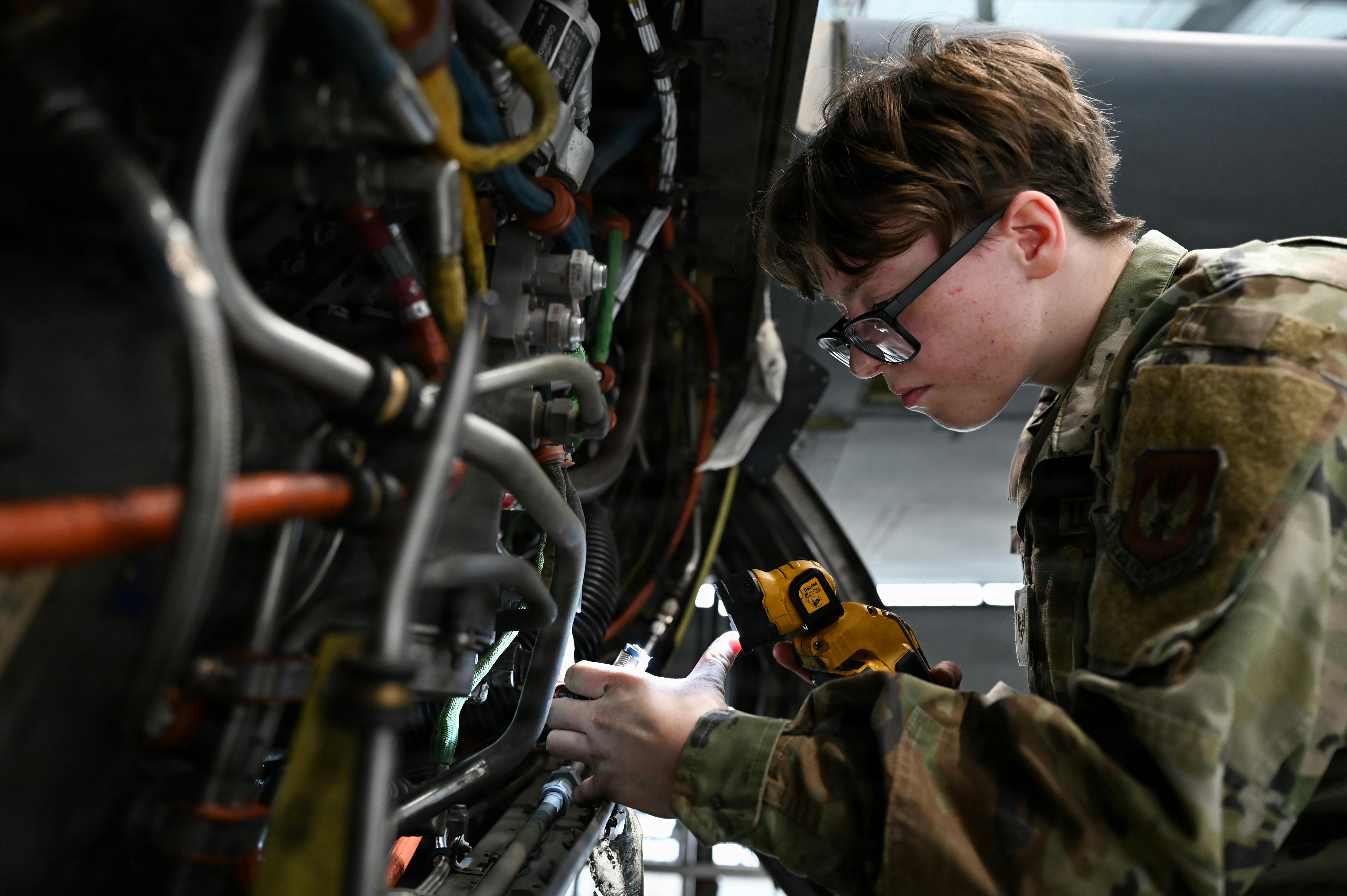 U.S. Air Force Senior Airman Heather Cummings, 86th Aircraft Maintenance Squadron aerospace inspection journeyman, reinstalls electrical connectors on a C-130J Super Hercules at Ramstein Air Base, Germany. U.S. Air Force photo by Airman 1st Class Rebecca Harima.