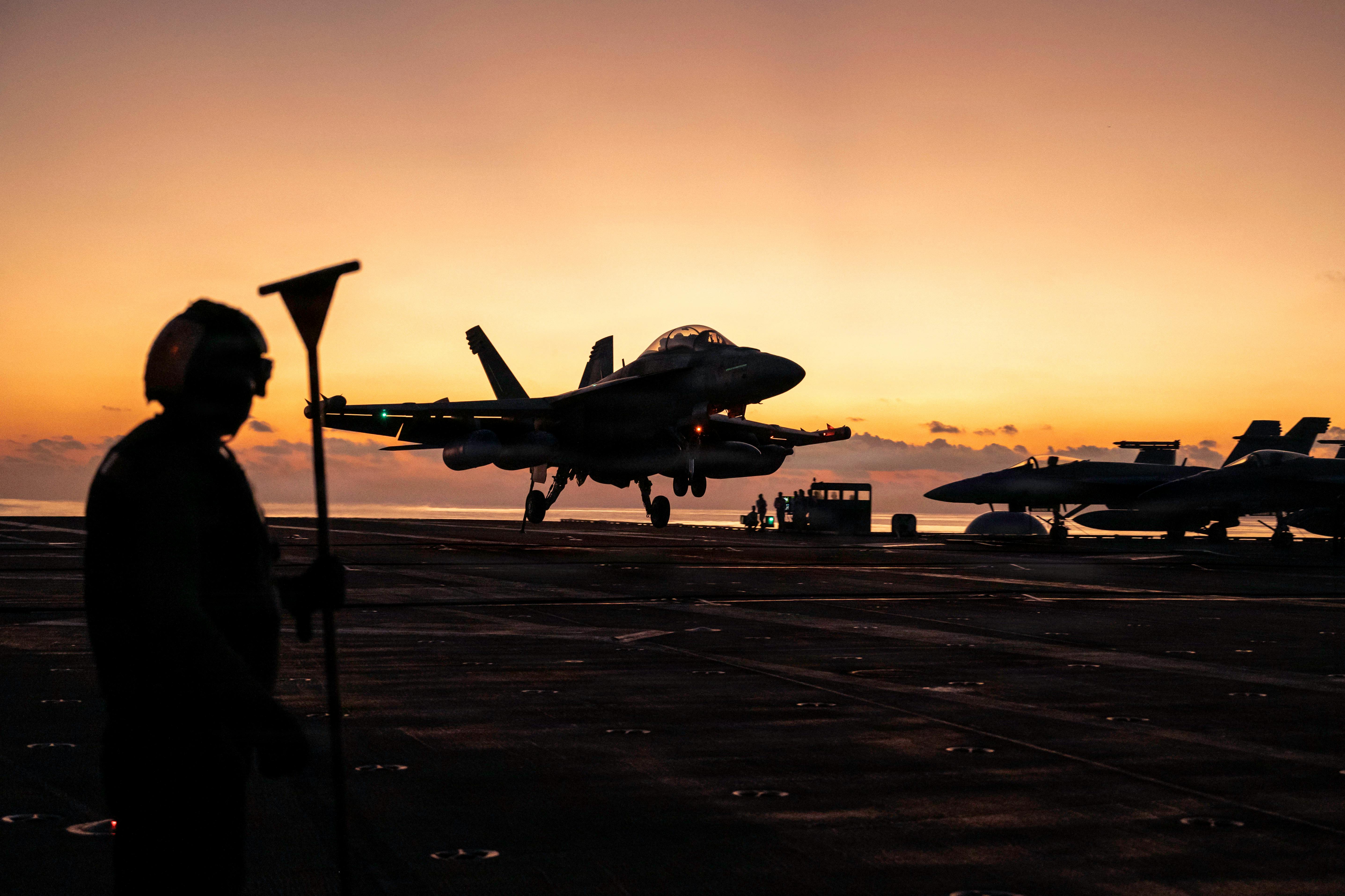 An EA-18G Growler, attached to Electronics Attack Squadron (VAQ) 141, lands on the flight deck of Nimitz-class aircraft carrier USS George Washington (CVN 73) while underway in the Philippine Sea. U.S. Navy photo by Mass Communication Specialist 3rd Class Juan Cordova.