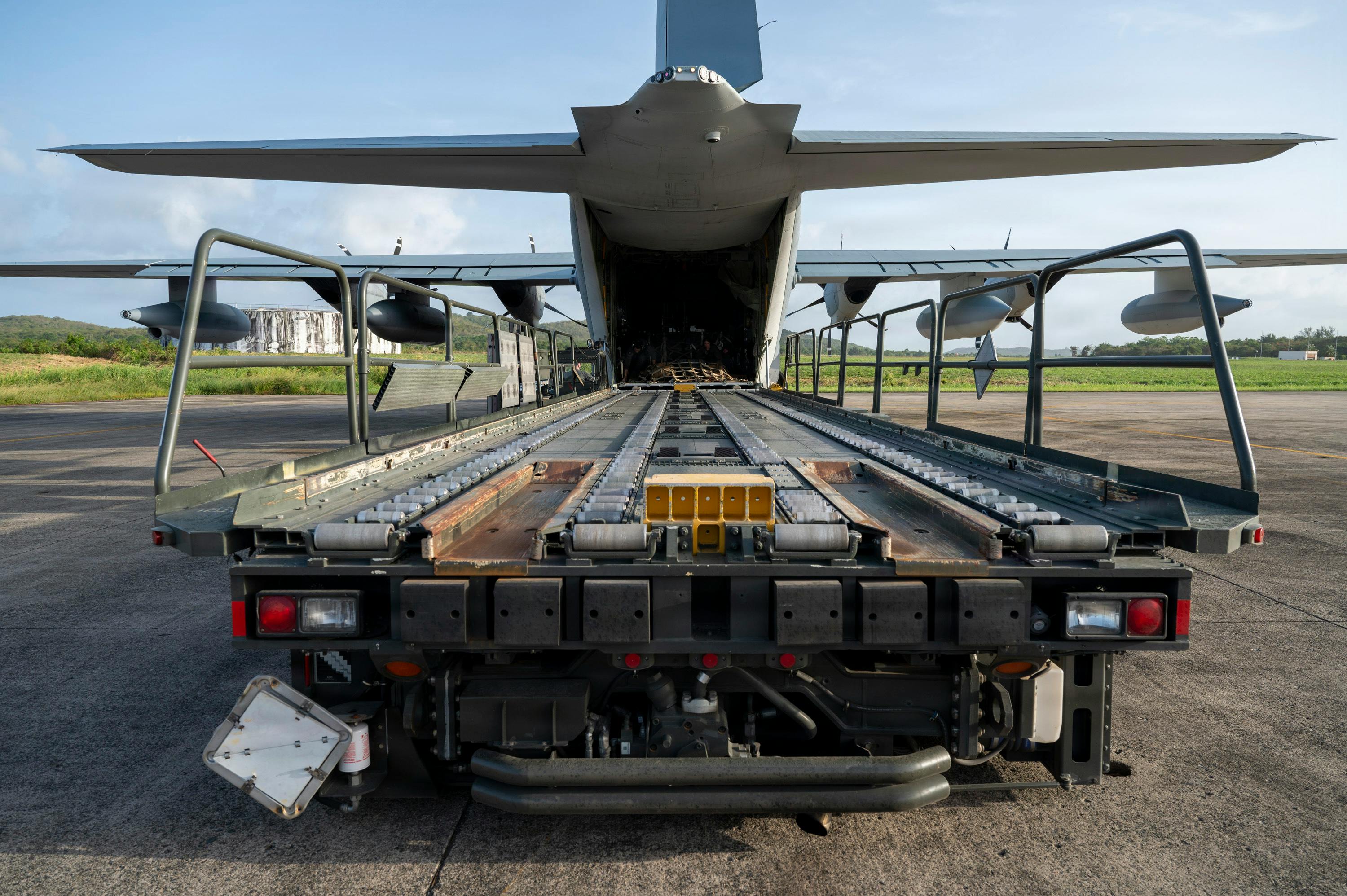 U.S. Marine Corps lance corporals and loadmasters, assigned to the 2nd Marine Aircraft Wing, prepare to offload cargo as part of a resupply run with Contingency Response Element Airmen assigned to the 621st Contingency Response Wing at Jose Aponte De La Torre Airport in Ceiba, Puerto Rico. USAF photo.