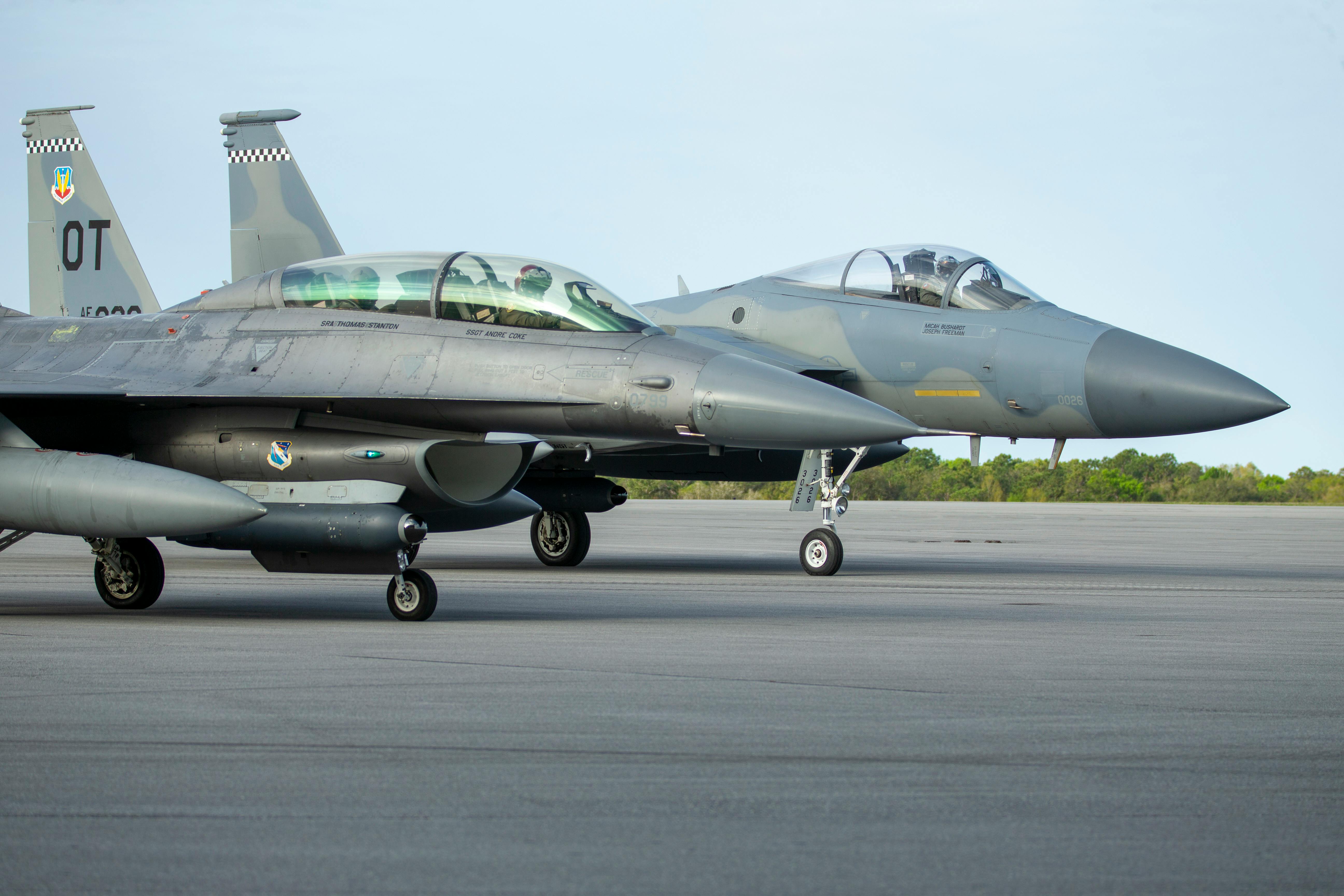 An F-16 and F-15 assigned to Eglin Air Force Base, Florida, prepare for a previous test of a datalink between two infrared search and track (IRST) pods. U.S. Air Force photo.