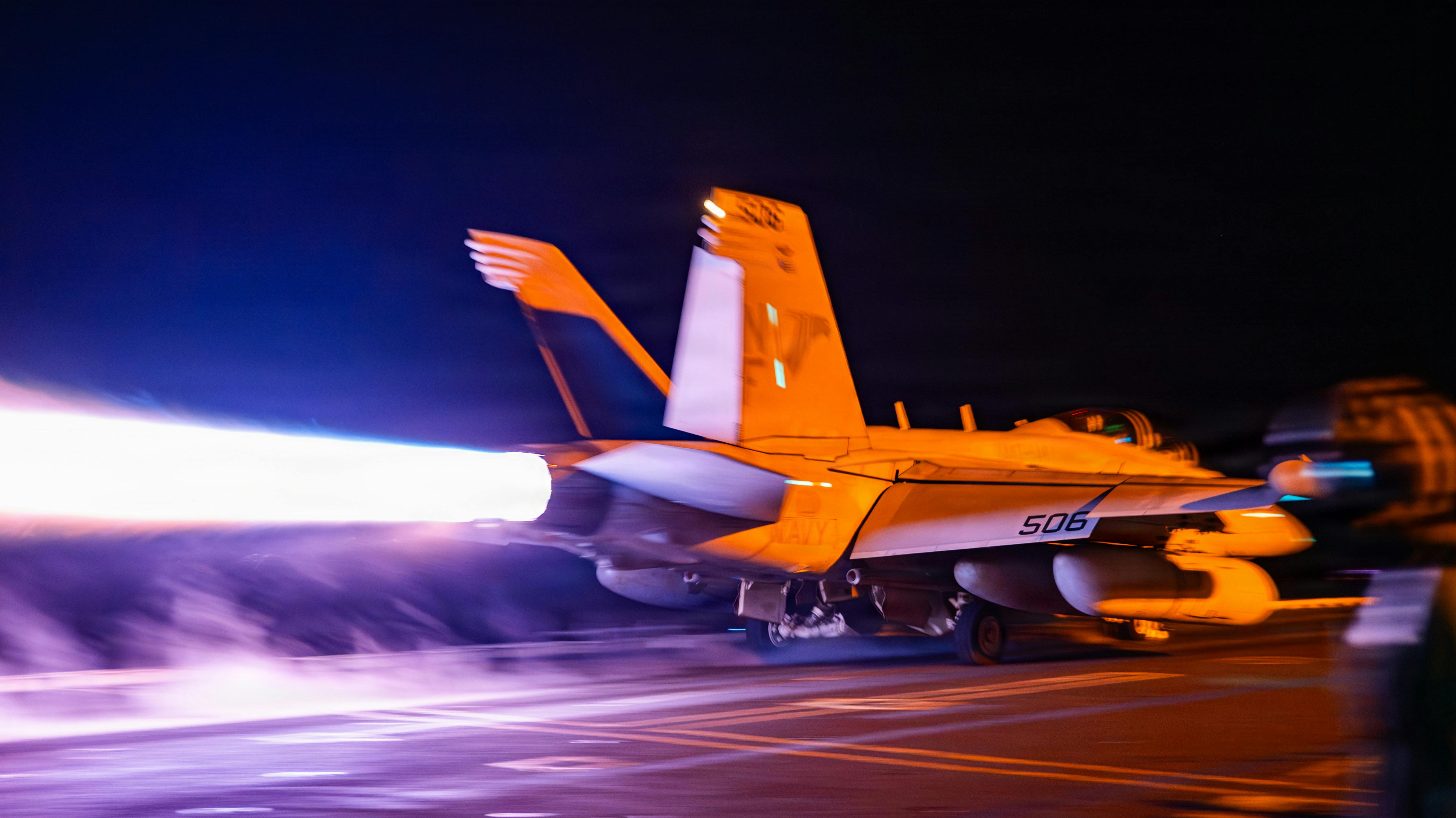 An E/A-18G Growler, attached to Electronic Attack Squadron (VAQ) 141, launches from the flight deck of the Nimitz-class aircraft carrier USS George Washington (CVN 73). George Washington is deployed to the U.S. 5th Fleet area of operations to support maritime security and stability in the Middle East. U.S. Navy photo.