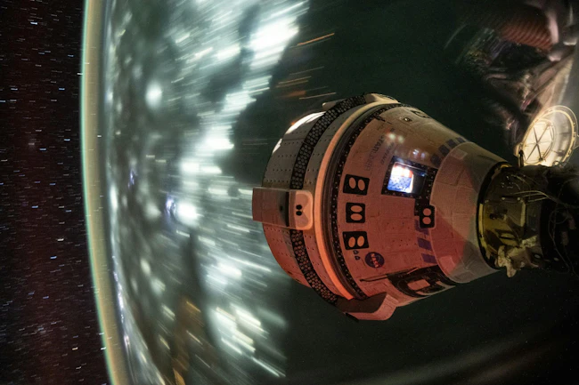 Boeing&rsquo;s Starliner spacecraft, which launched NASA&rsquo;s Crew Flight Test astronauts Butch Wilmore and Suni Williams to the International Space Station, is pictured docked to the Harmony module&rsquo;s forward port. This long-duration photograph was taken on July 3, 2024, from the orbital complex as it soared 256 miles above the Arabian Sea off the coast of Mumbai, India. NASA photo.