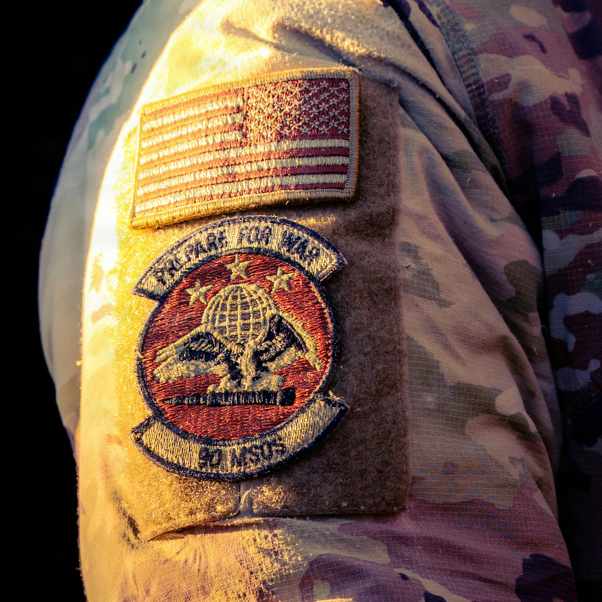 A 90th Missile Security Operations Squadron patch adorns the right shoulder of a 90 MSOS Convoy Response Force Airman during the Nuclear Convoy Course at Camp Guernsey Joint Training Center, Wyo. U.S. Air Force photo by Airman 1st Class Hunter C. Kirkland.